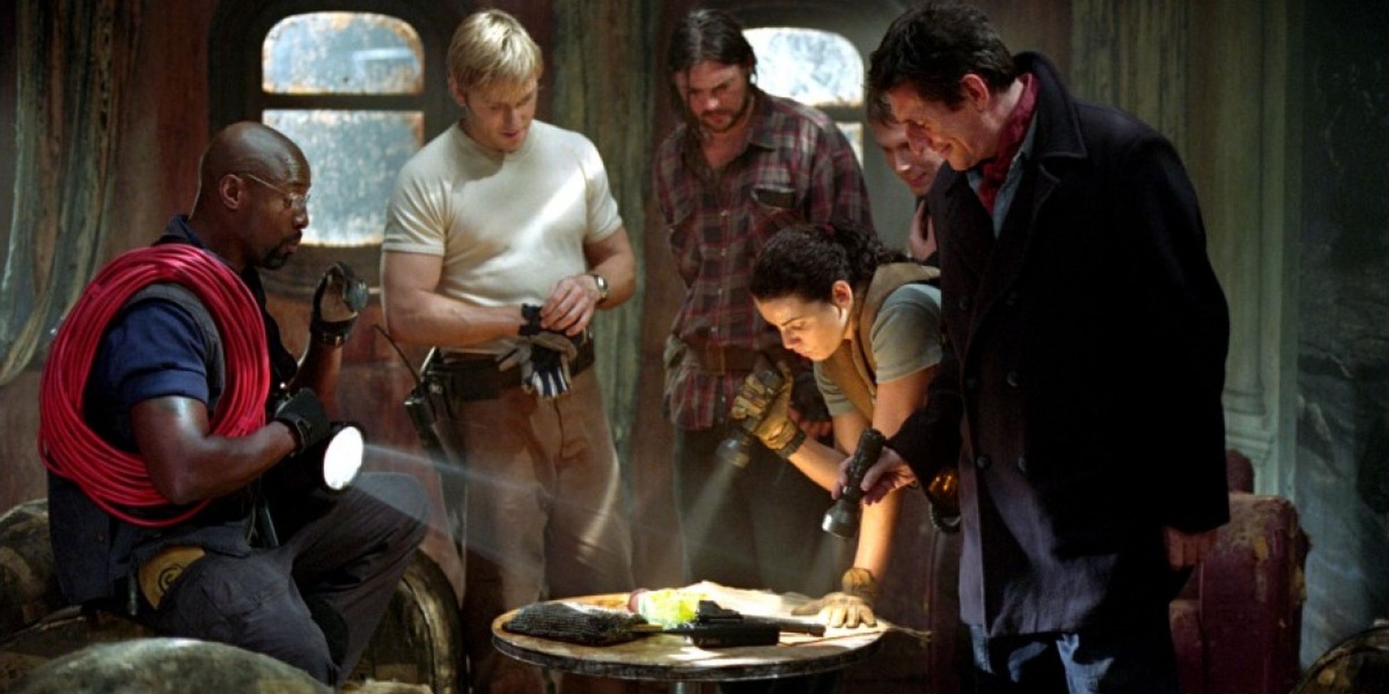 A salvaging crew staring at plans on a table