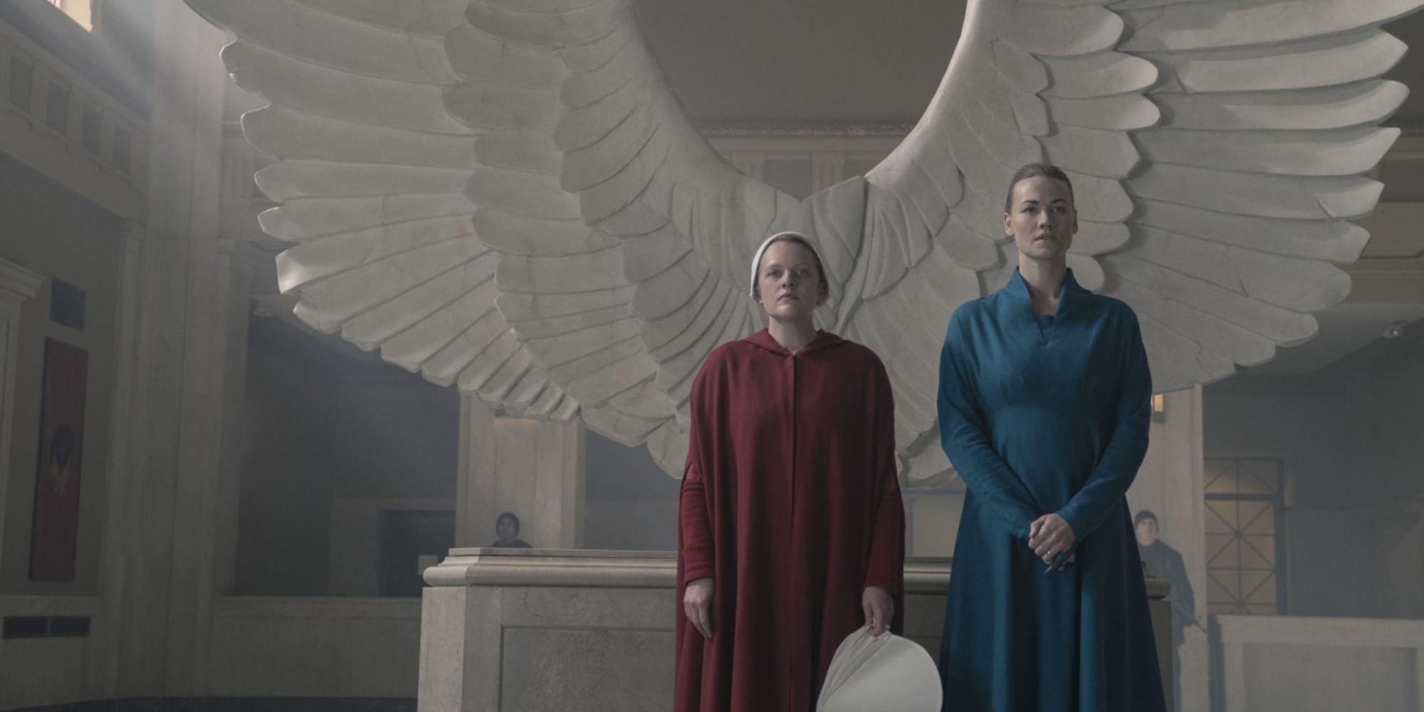 Offred standing beside Serena Joy