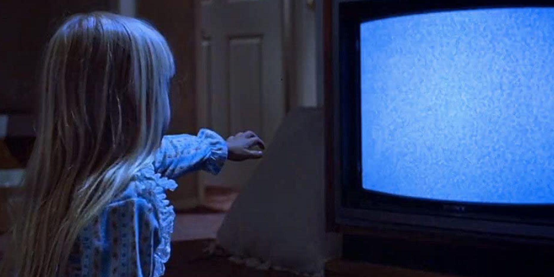 Heather O'Rourke pointing at the TV in 'Poltergeist'