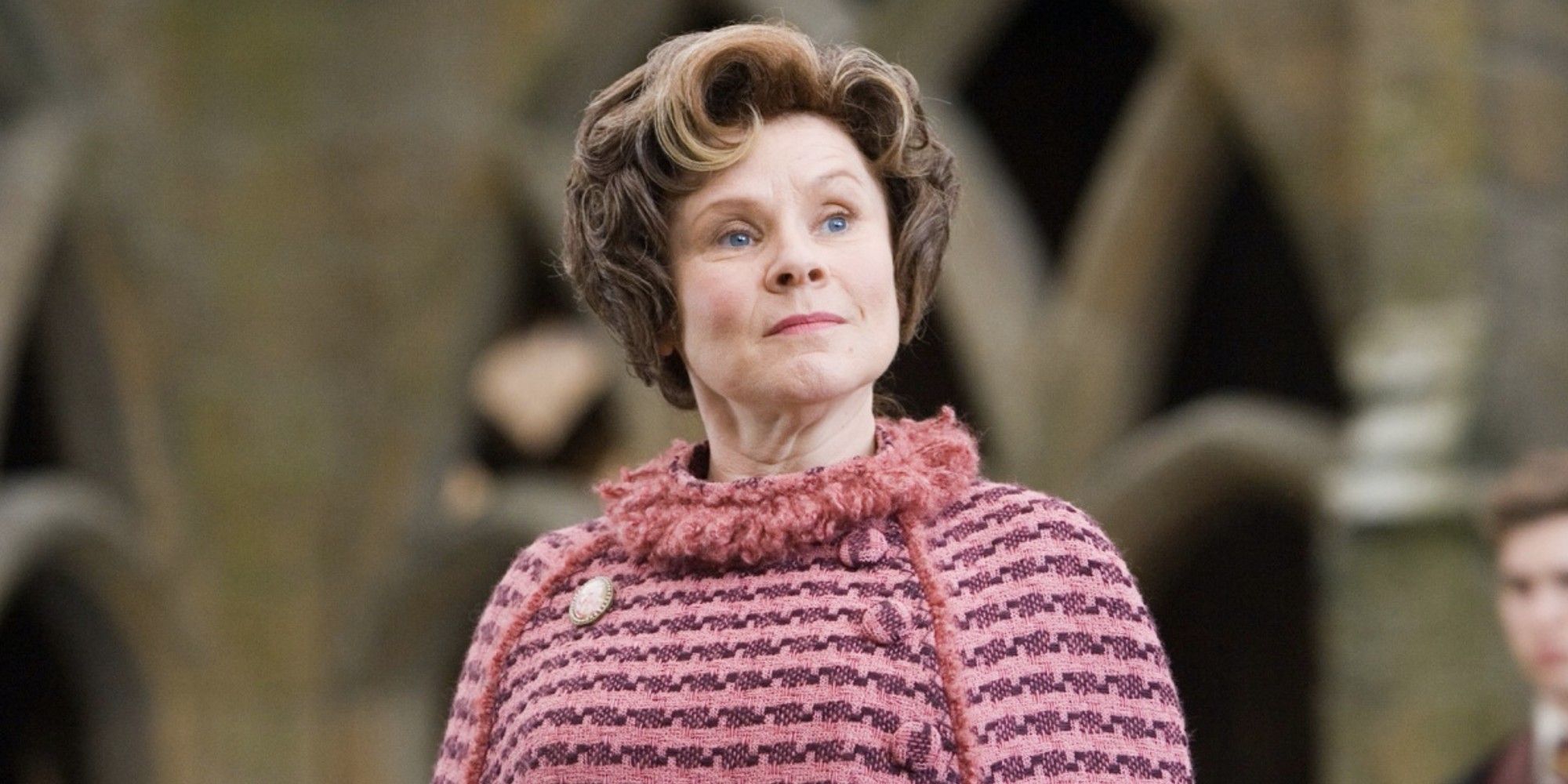 Dolores Umbridge standing proud and looking to the distance in 'Harry Potter and the Order of the Phoenix'