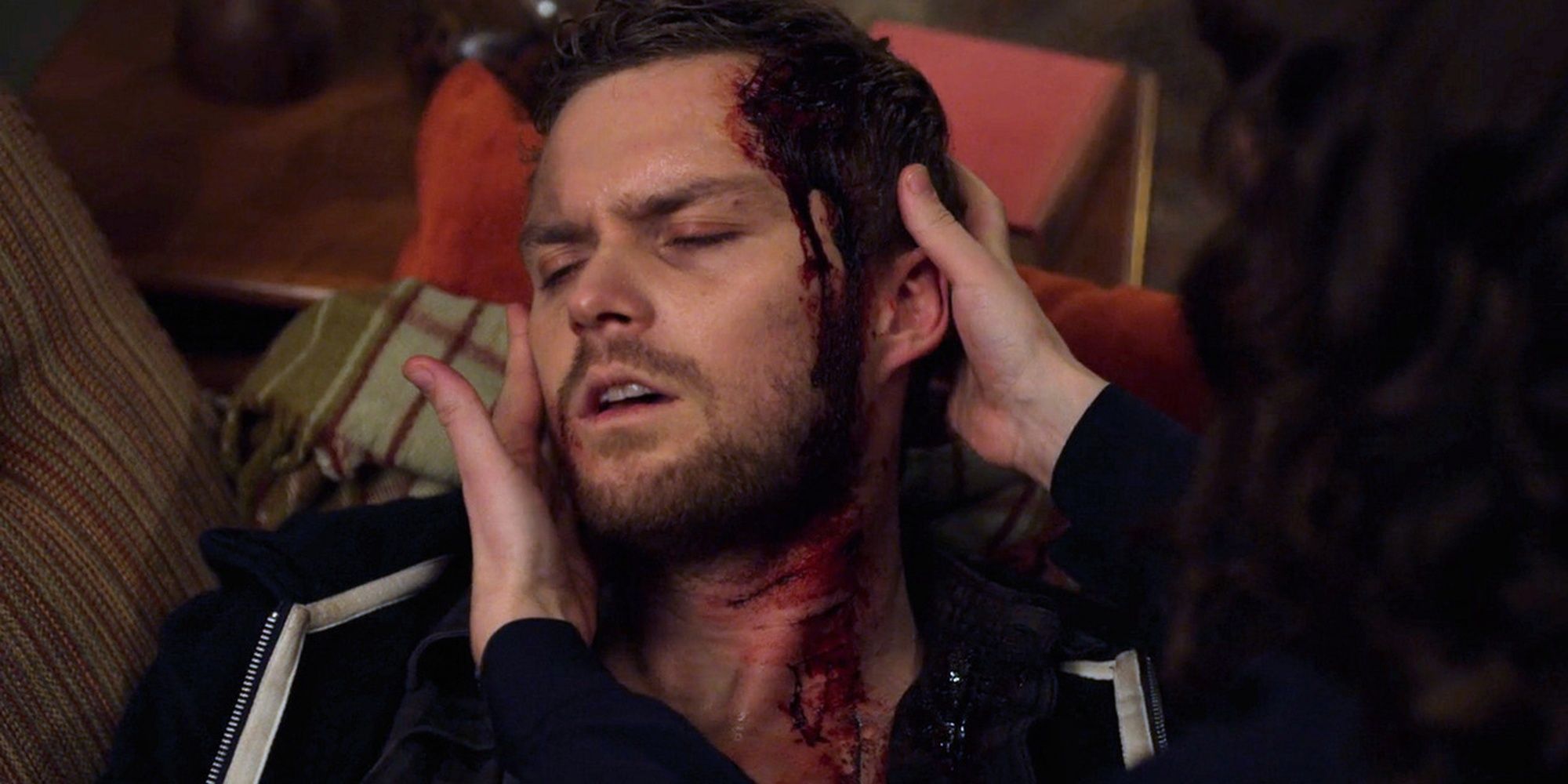 Finn Jones as Dunny Hunt with a bleeding wound to his head in Iron Fist