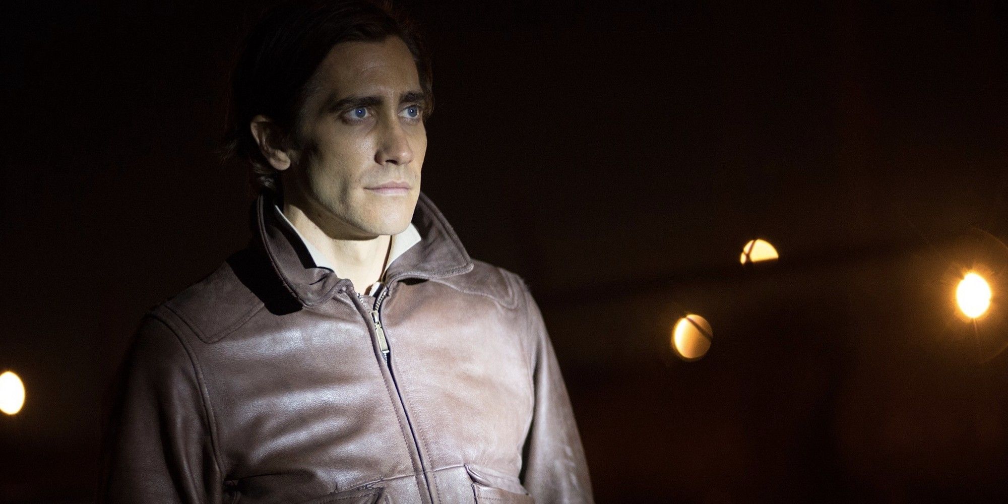 Louis Bloom standing in the dark looking ahead in 'Nightcrawler'