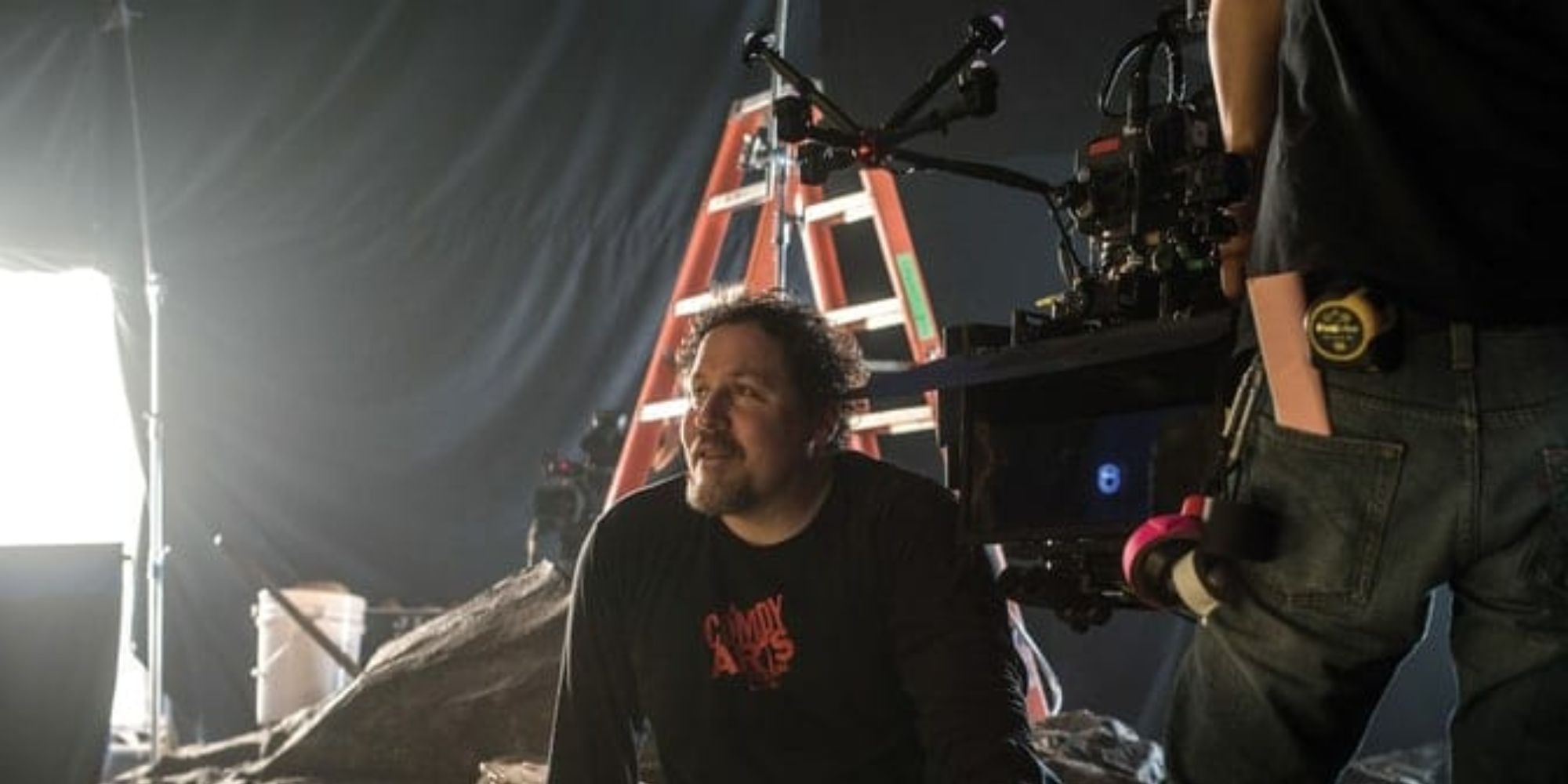 A man taking a break from filmming