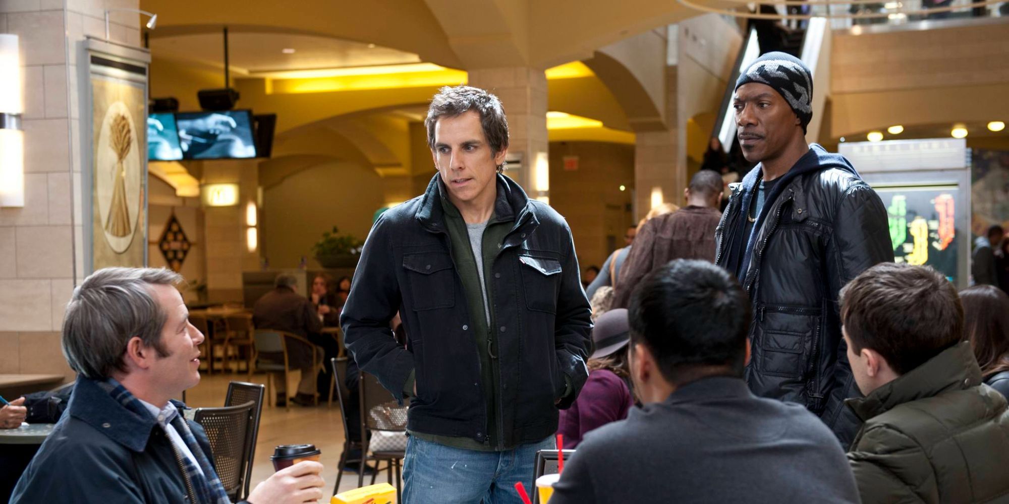 Matthew Broderick, Ben Stiller and Eddie Murphy hanging out in a mall food court in Tower Heist
