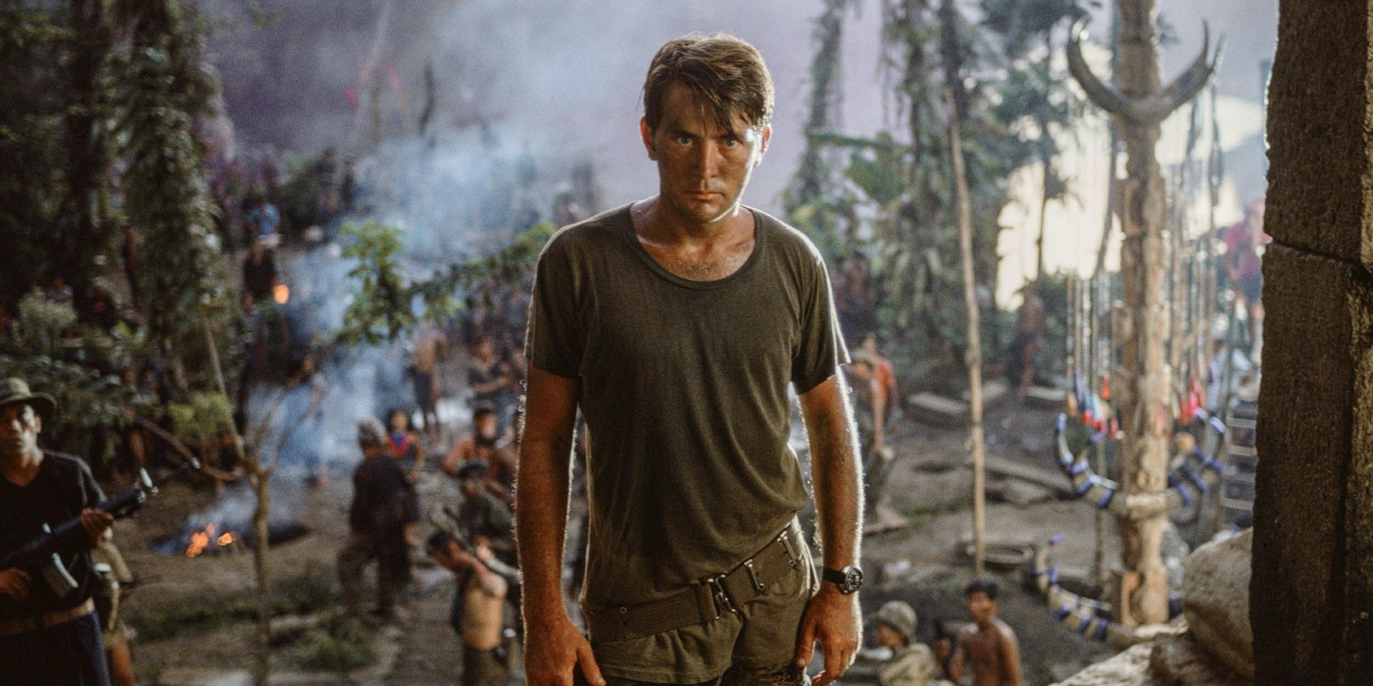 Martin Sheen U.S. Army Captain Benjamin L. Willard, staring intensely while other soldiers stand behind him in 'Apocalypse Now'