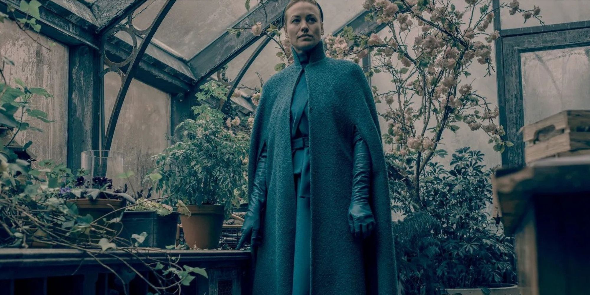 Serena standing in her greenhouse
