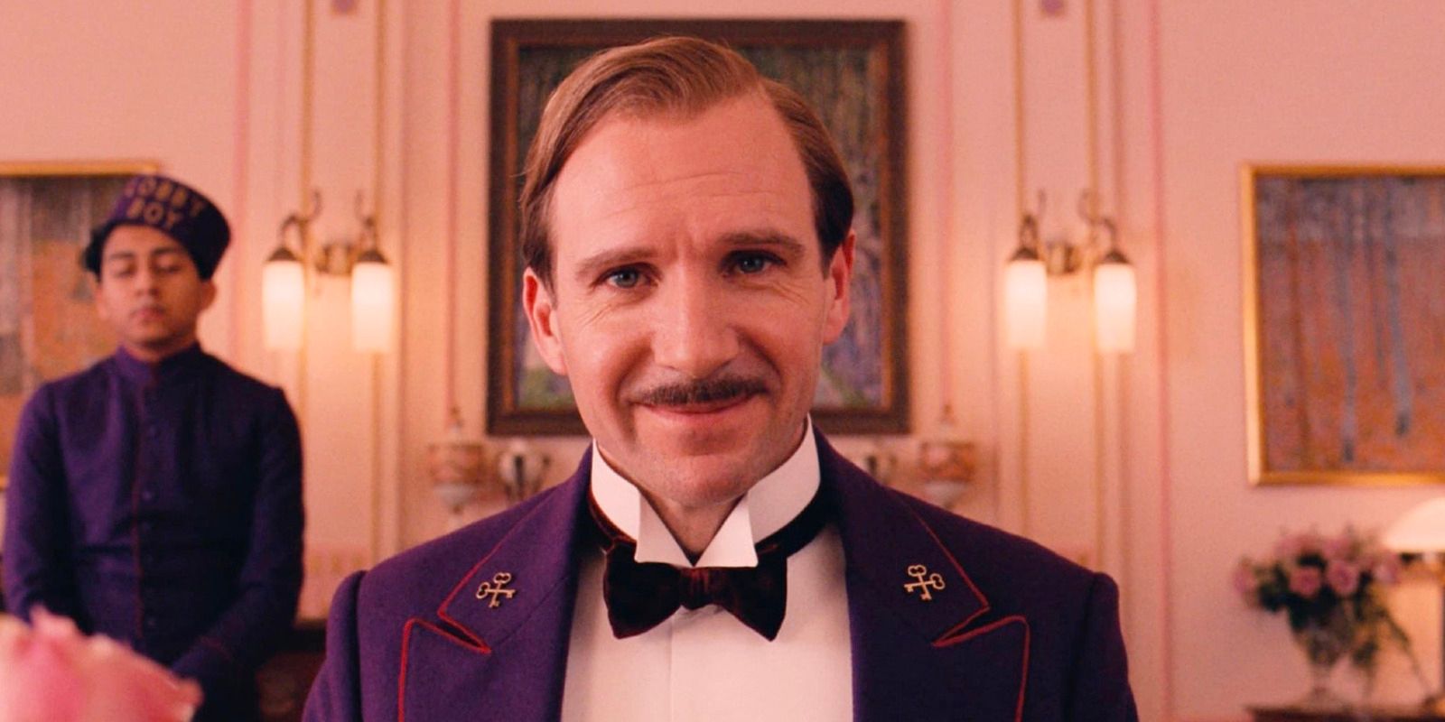 M. Gustave smiling at the camera in The Grand Budapest Hotel