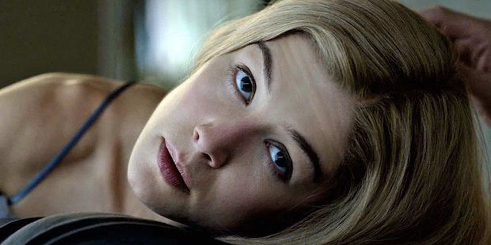 Rosamund Pike looking at the camera in Gone Girl