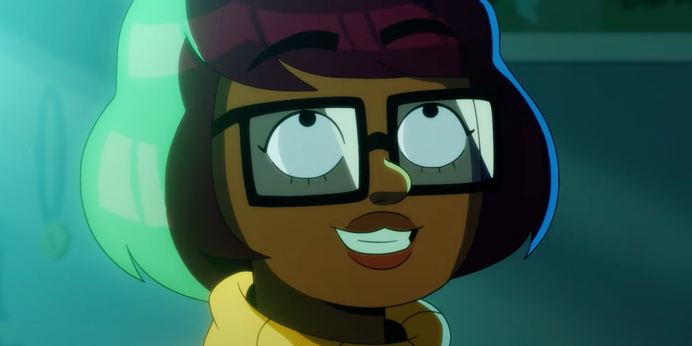 Velma, as voiced by Mindy Kaling, smiling and looking up 