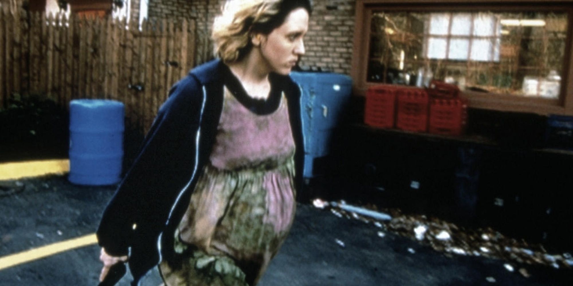 Brooke Smith walking with a handgun in Series 7