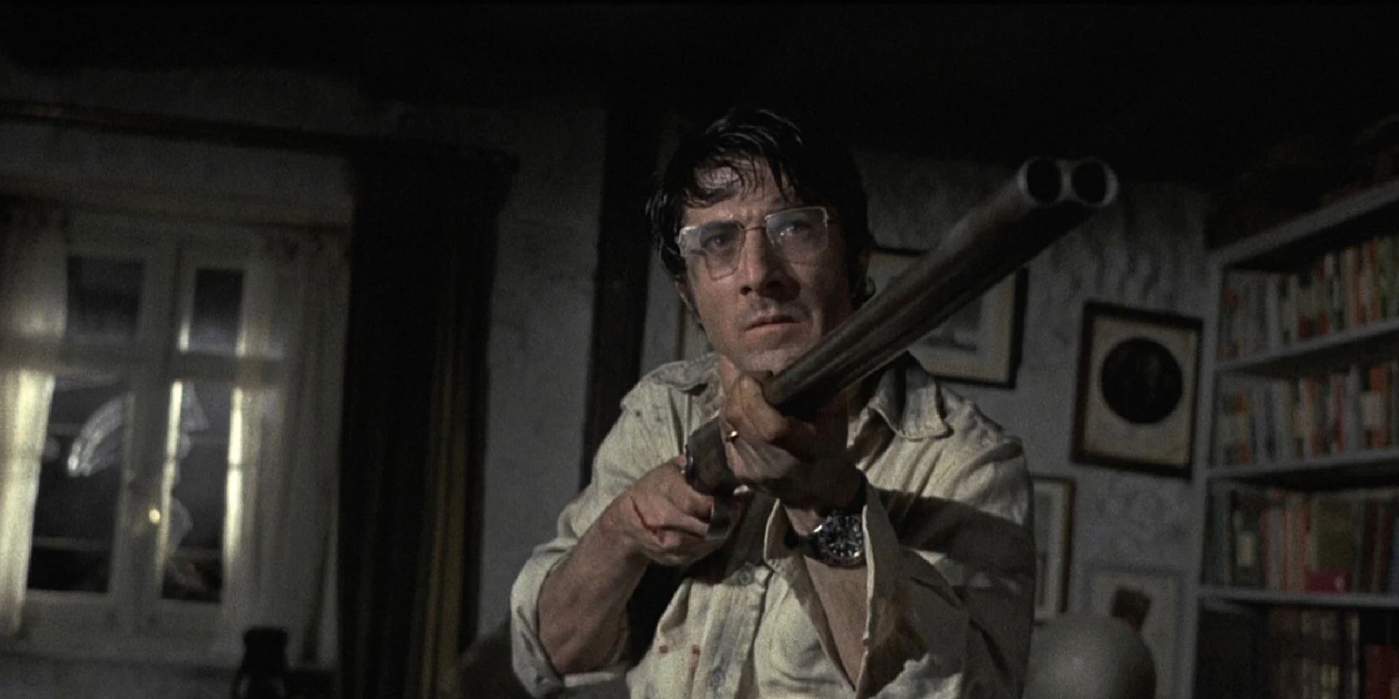 Dustin Hoffman as David Sumner holding a gun in Straw Dogs