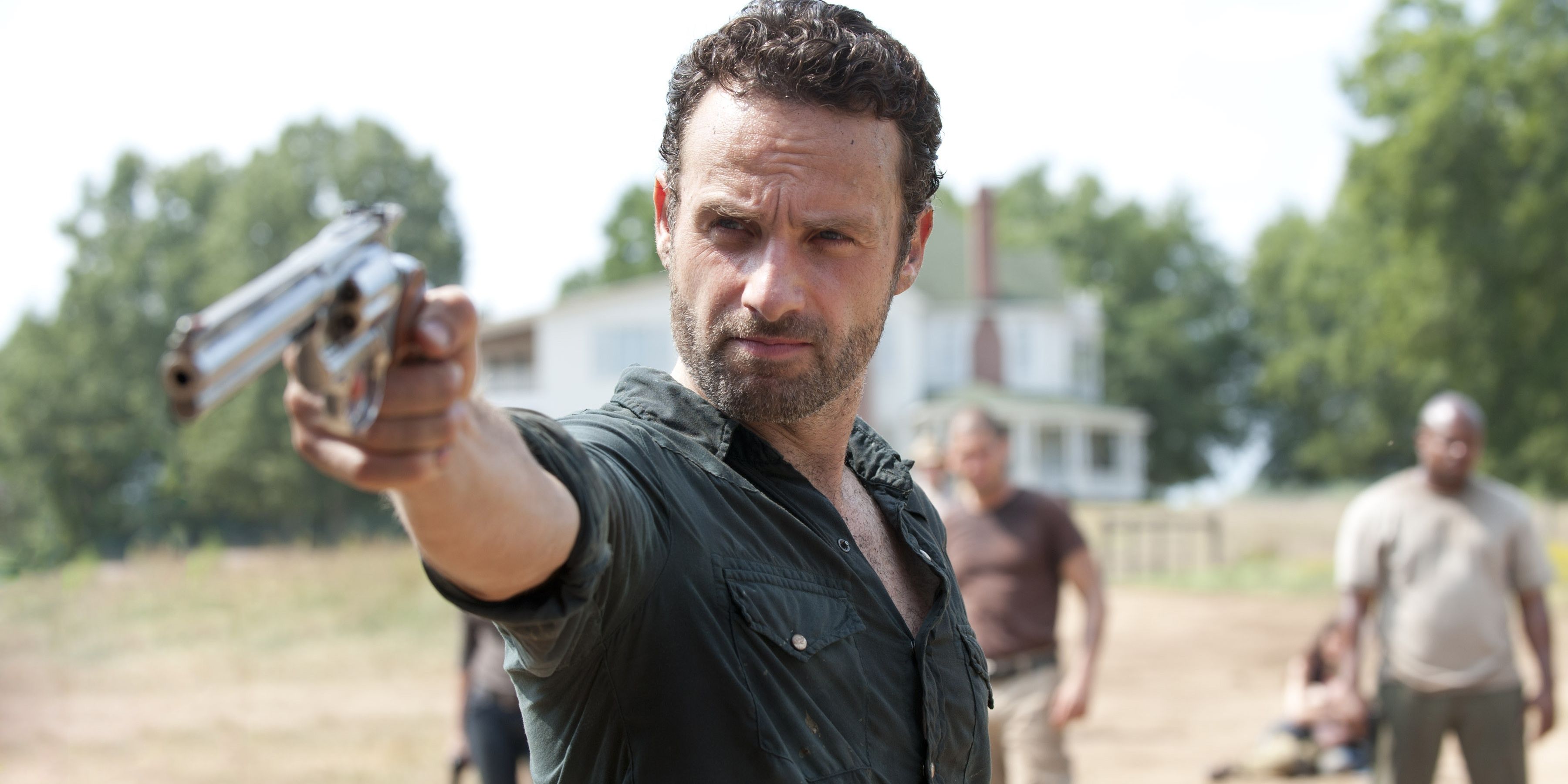 Rick Grimes looks down the sights of his revolver while executing a zombie on Hershel's farm.