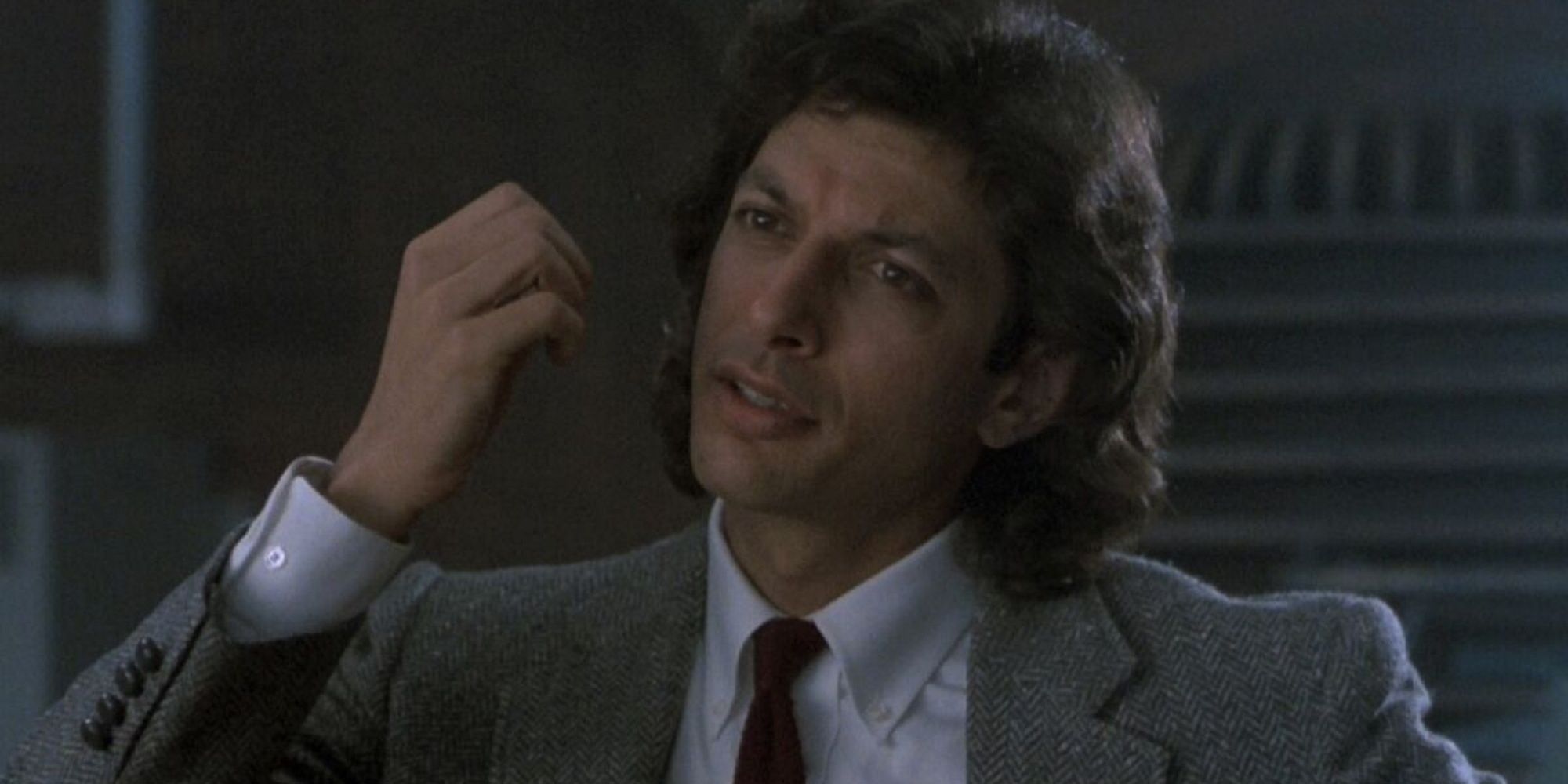 Seth Brundle looking smug in a suit in 'The Fly.'