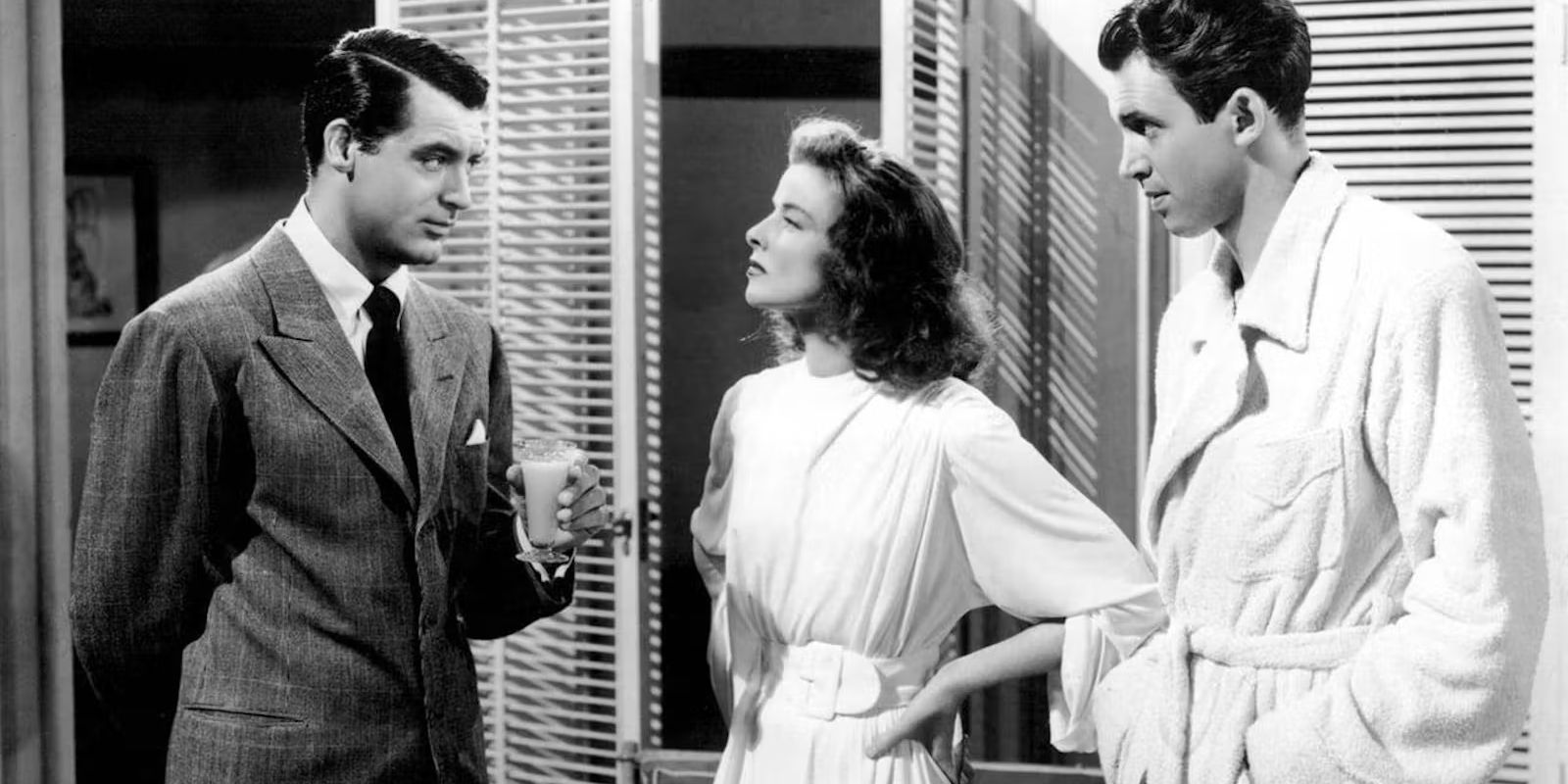 Dexter, Tracy, and Mike talking in the film The Philadelphia Story.