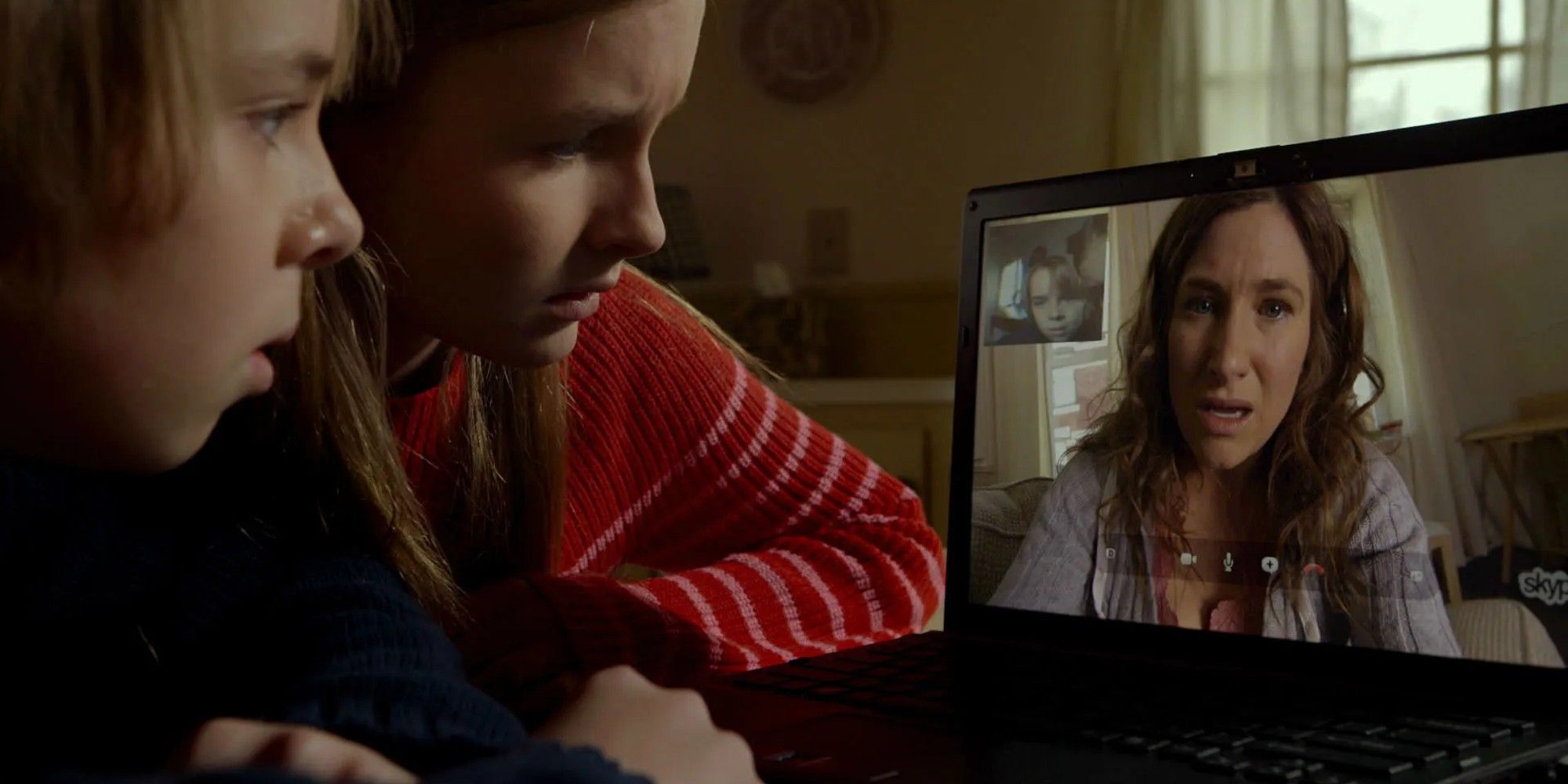 Two children talking to their mother via webchat in the 2015 movie The Visit.