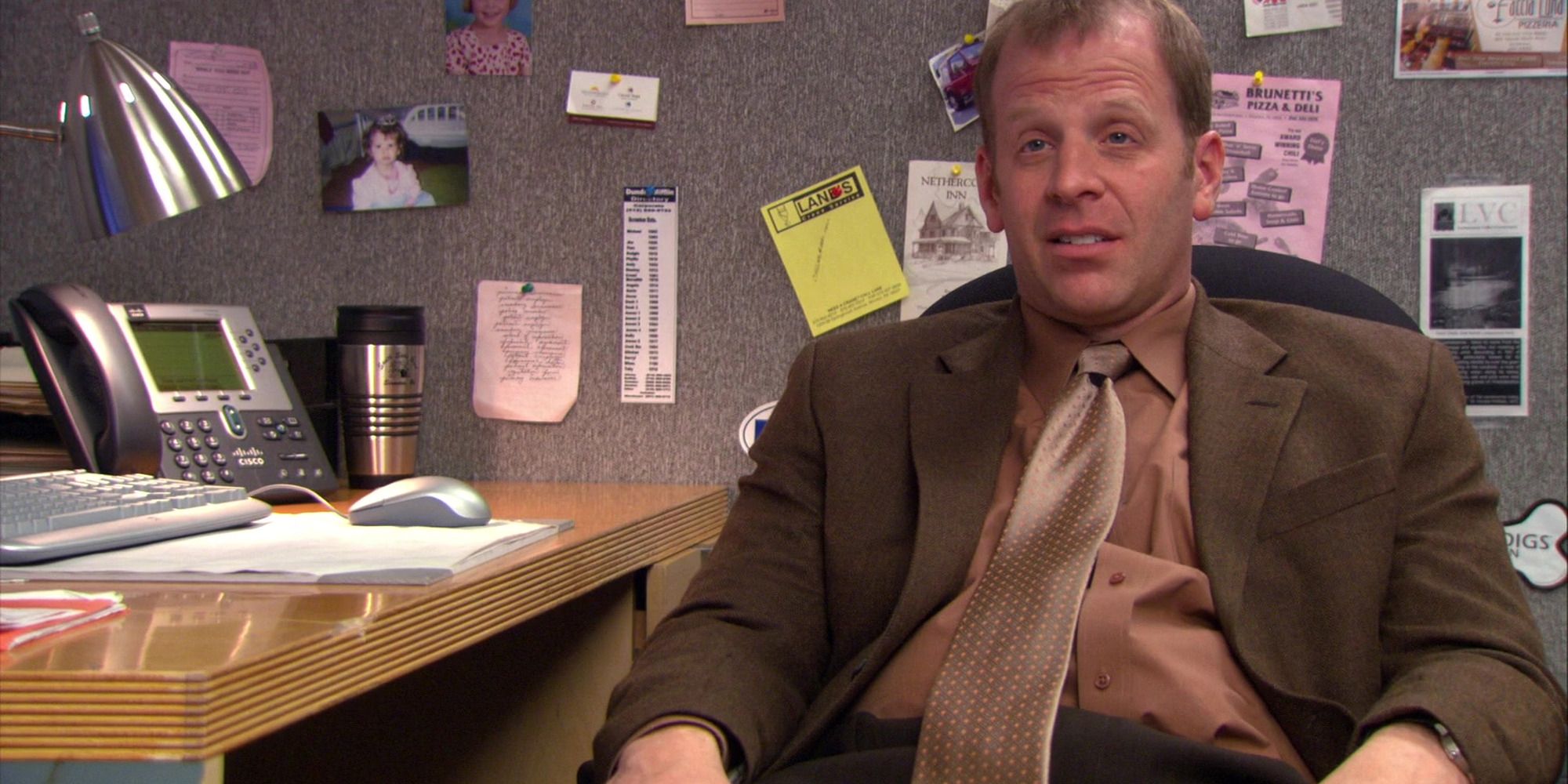 Toby Flenderson sitting at his desk
