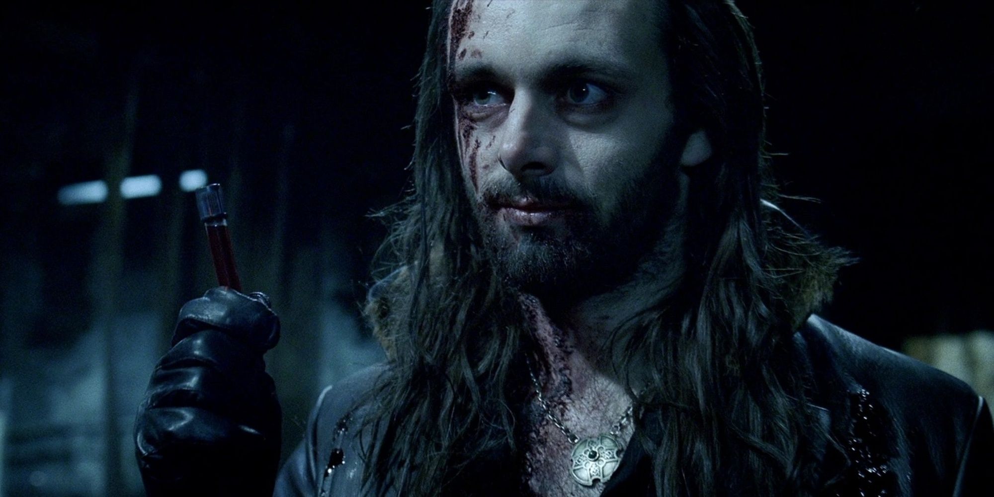 A beaten up Michael Sheen as Lucian with a vial of blood in Underworld