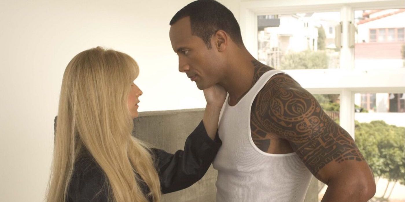 Krysta and Boxer talking while standing face-to-face in the film Southland Tales.
