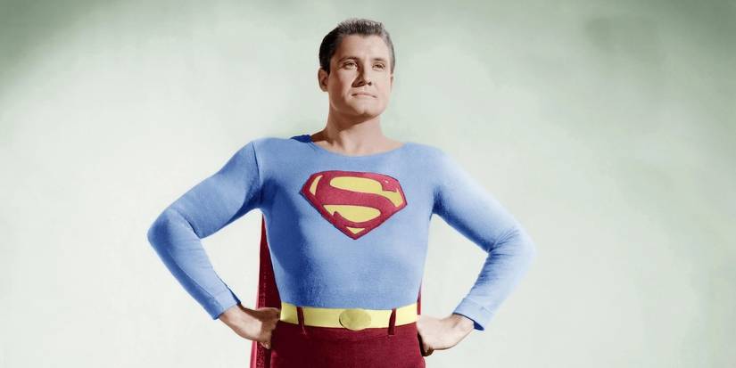 Superman posing with his hands on his waist in the show Adventures of Superman.