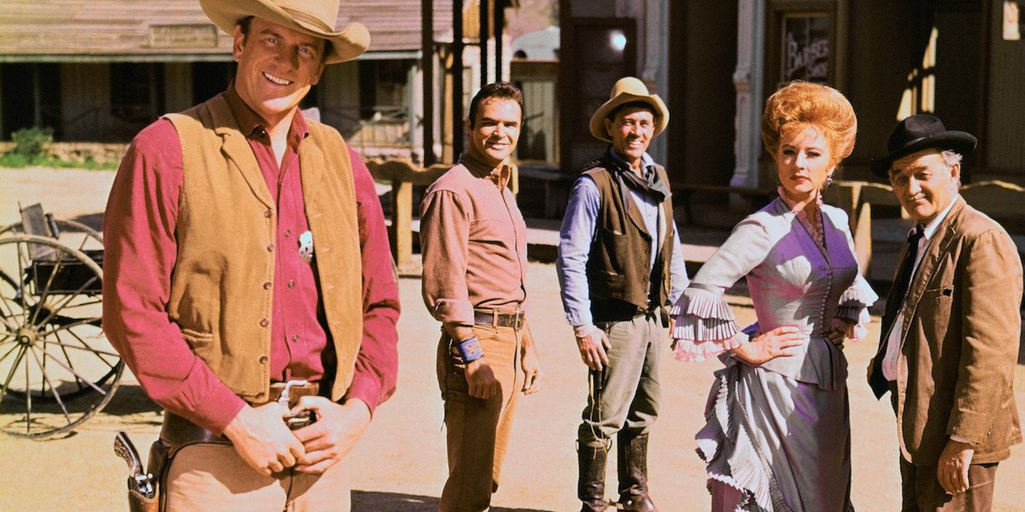 Saloon owner Miss Kitty with other characters in the TV show Gunsmoke.