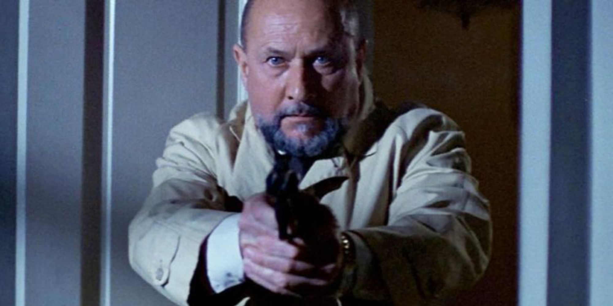 Donald Pleasence pointing a gun in Halloween