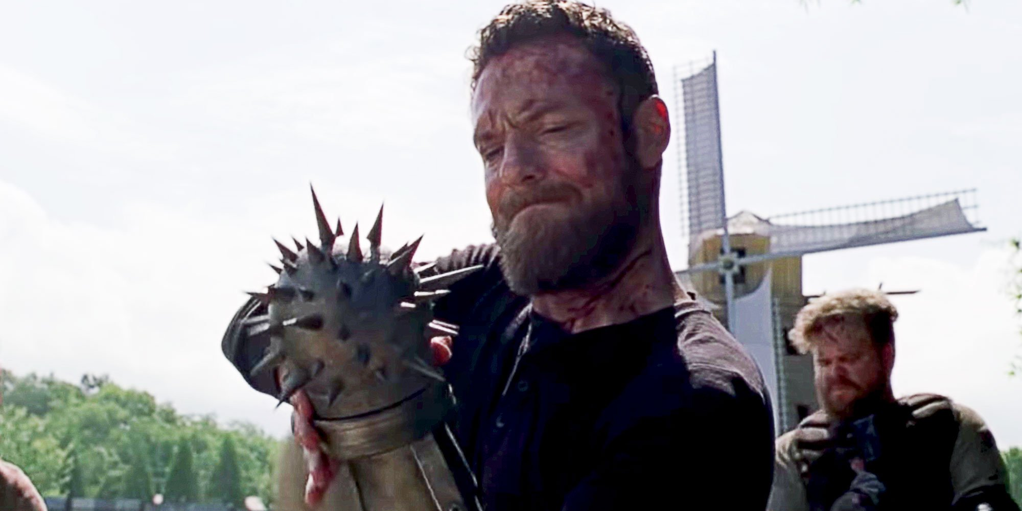 Aaron adjusts the spiked metal ball attached to his arm before a battle in 'The Walking Dead'