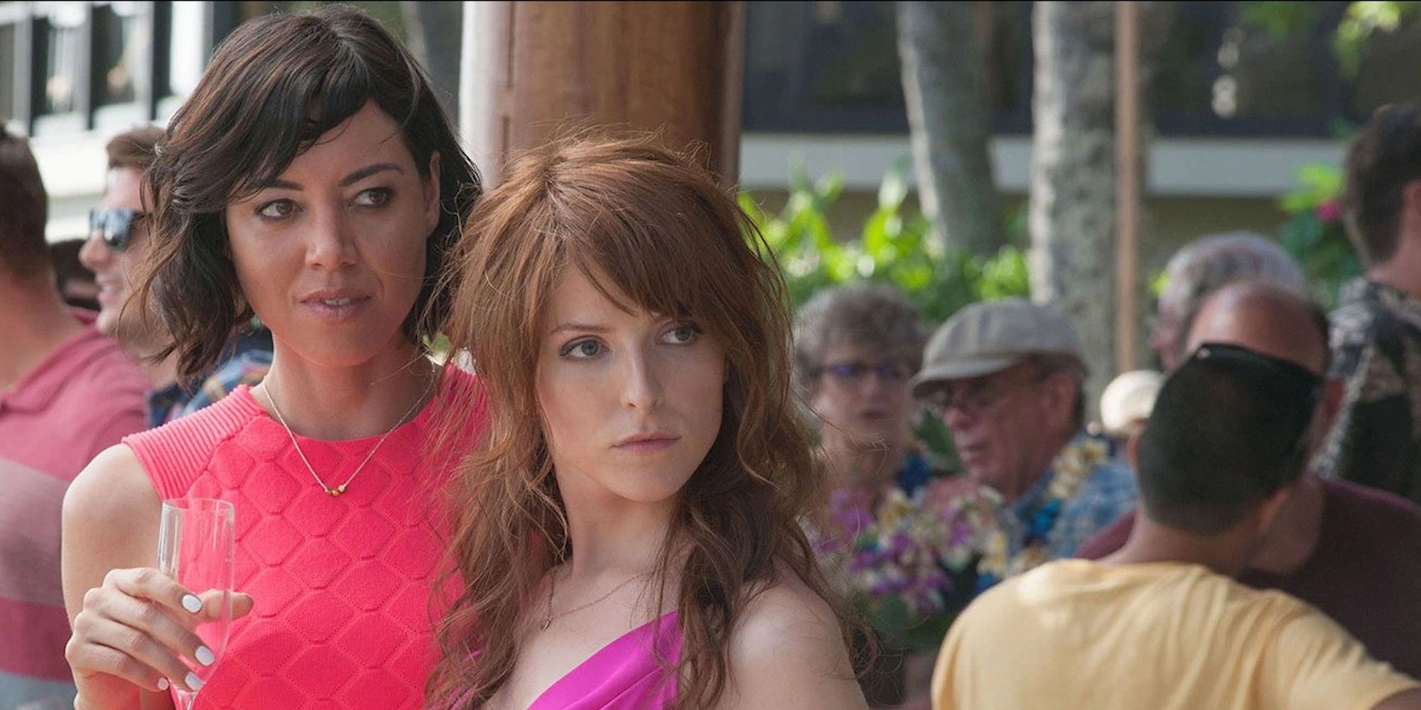 Tatiana and Alice looking in the same direction in Mike And Dave Need Wedding Dates.