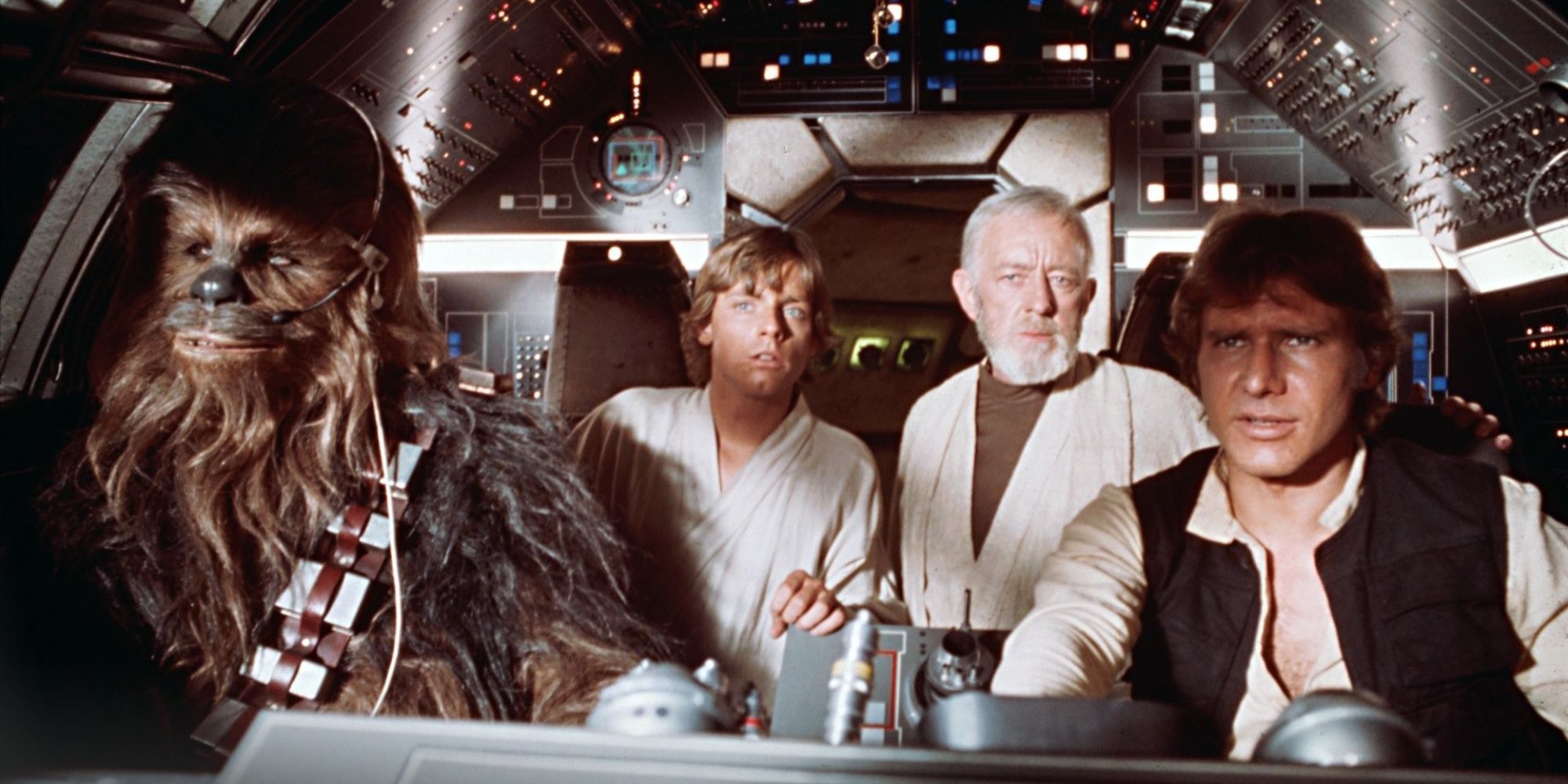 Han and Chewbacca pilot the Millennium Falcon, with Luke and Obi-Wan in the back