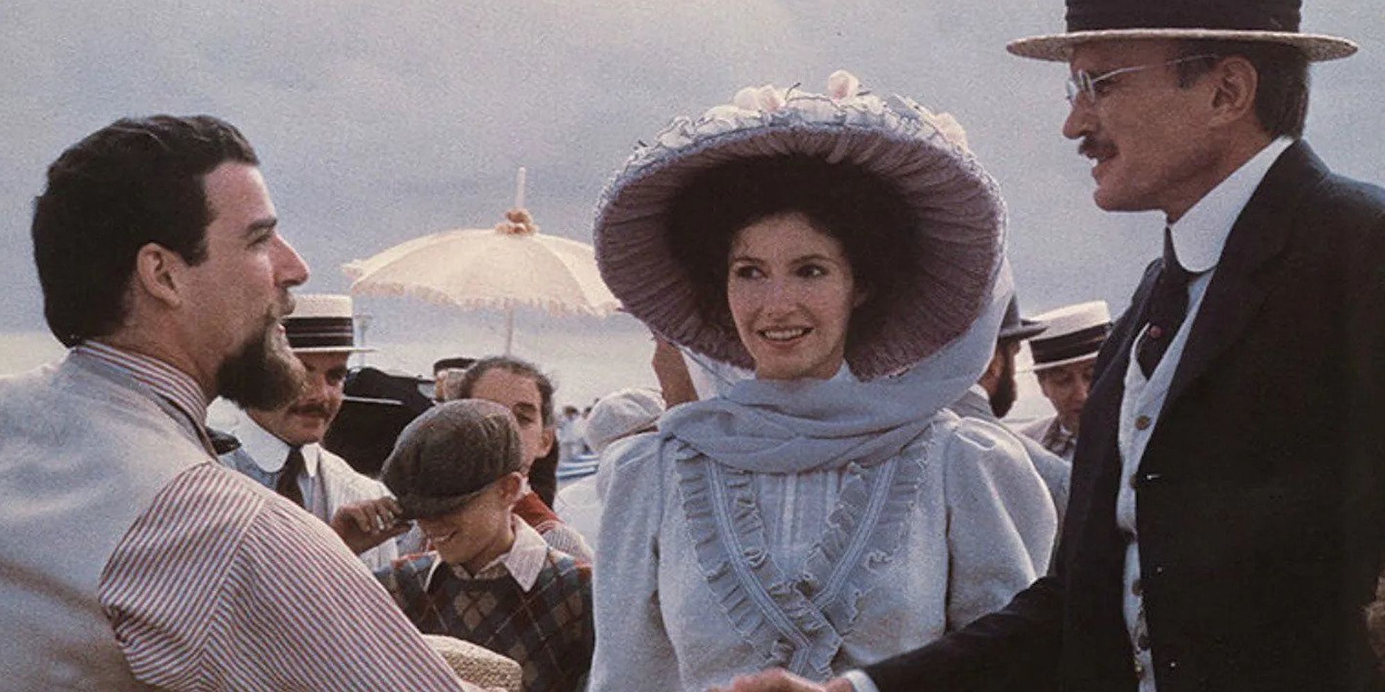 Mandy Patinkin and James Olson as Tateh and Father shaking hands while Mary Steenburgen as Mother stands looking in Ragtime