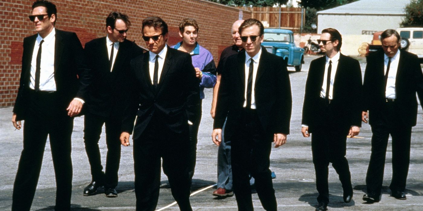The cast of 'Reservoir Dogs' wearing black suits and walking down the street