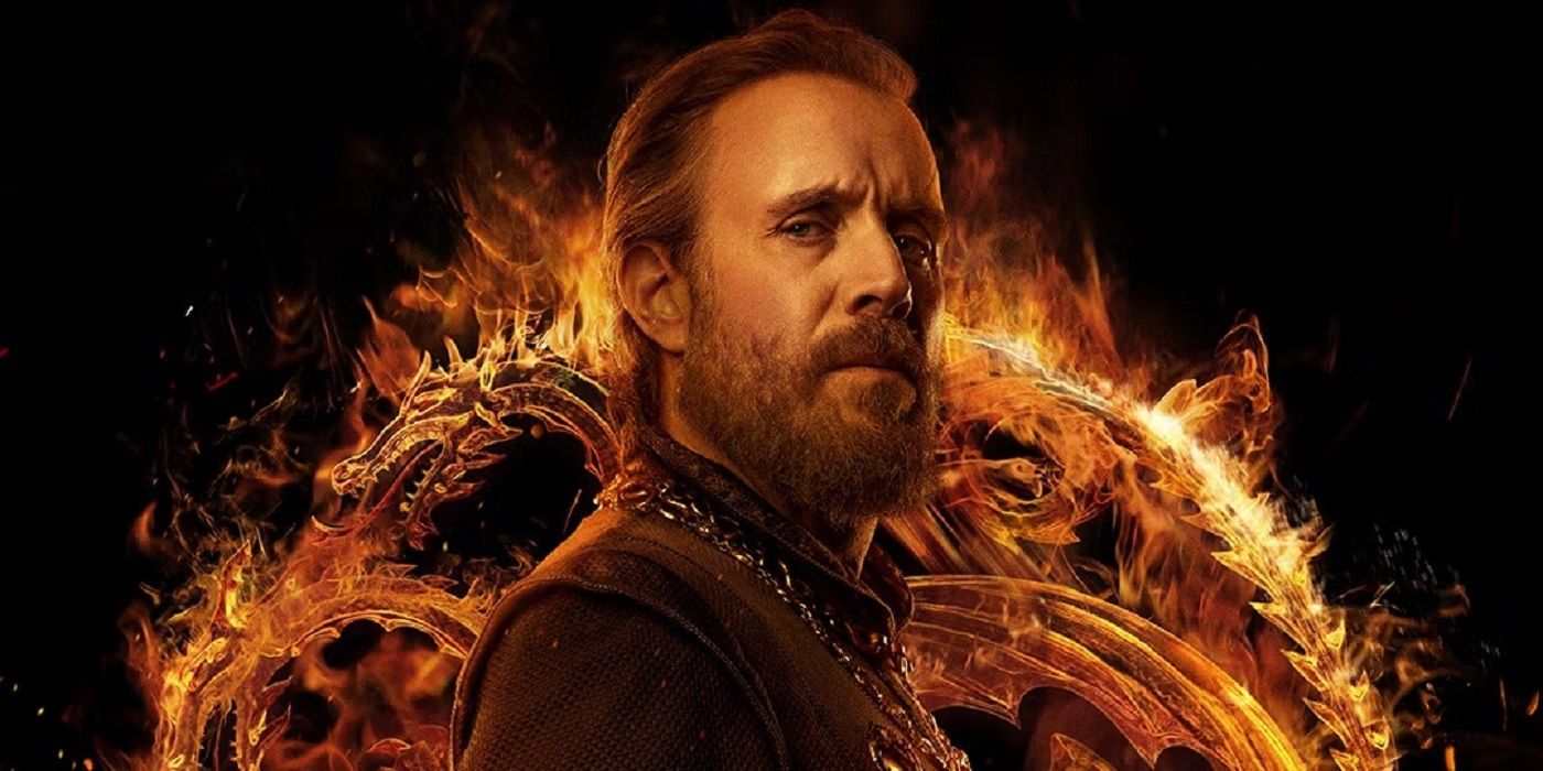 Rhys Ifans as Otto Hightower, surrounded by a burning Targaryen banner, in a House of the Dragon poster.