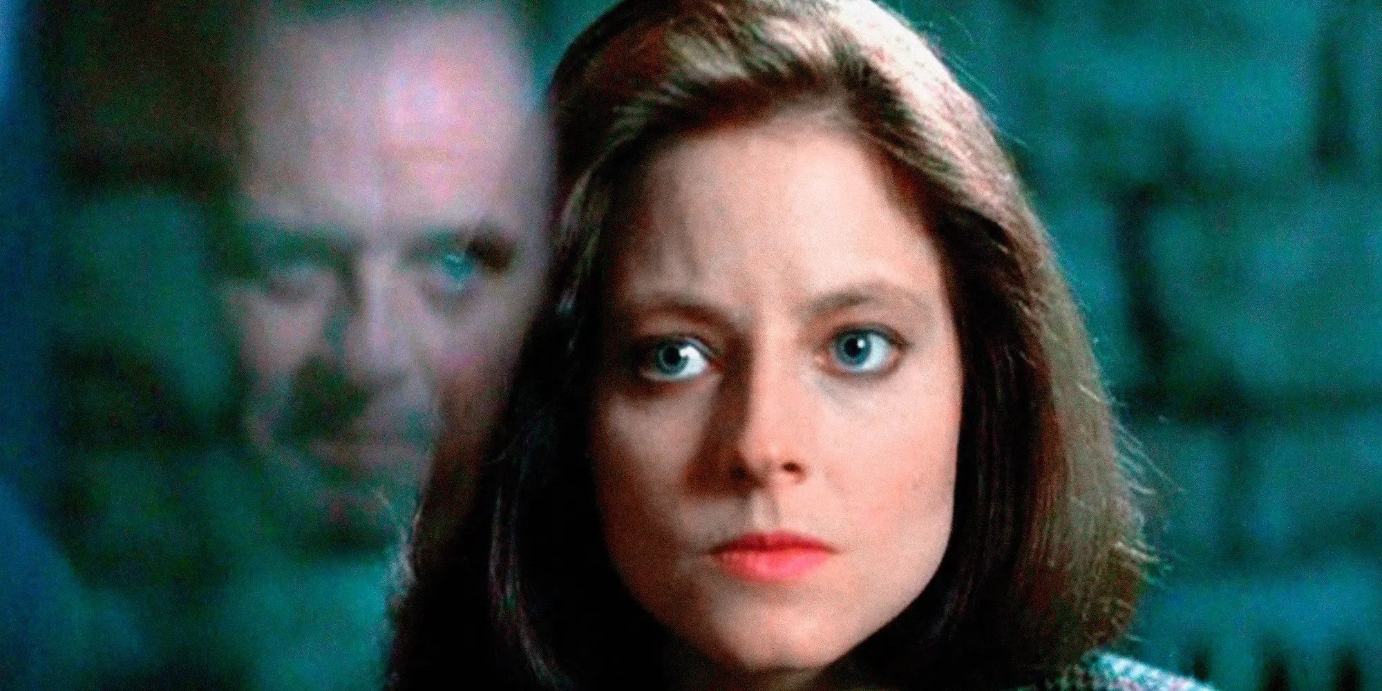 Clarice looks at the glass where Hannibal's face is reflected in The Silence Of The Lambs.