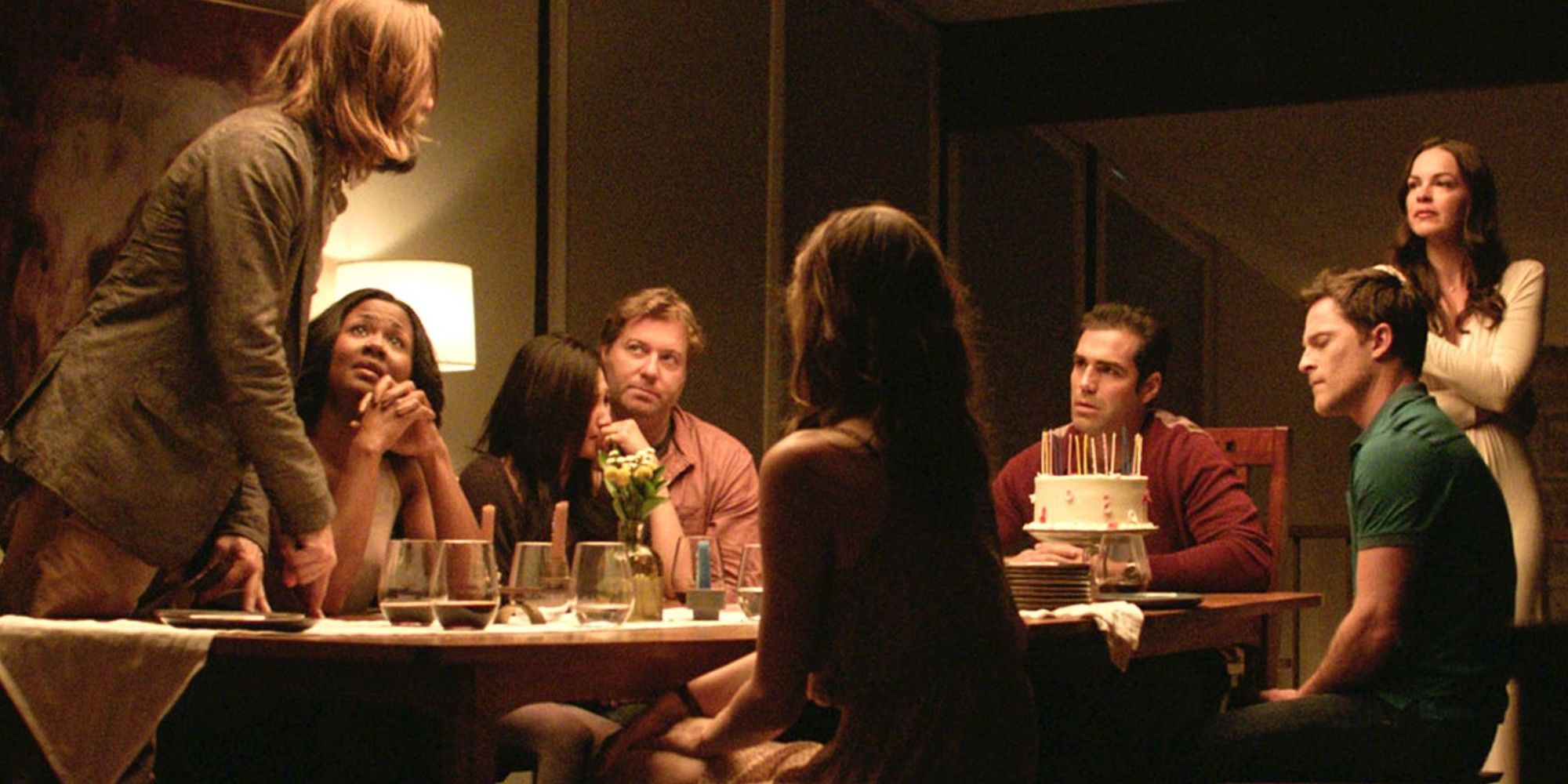The Invitation cast, including Logan Marshall Green, gathered around the dinner table