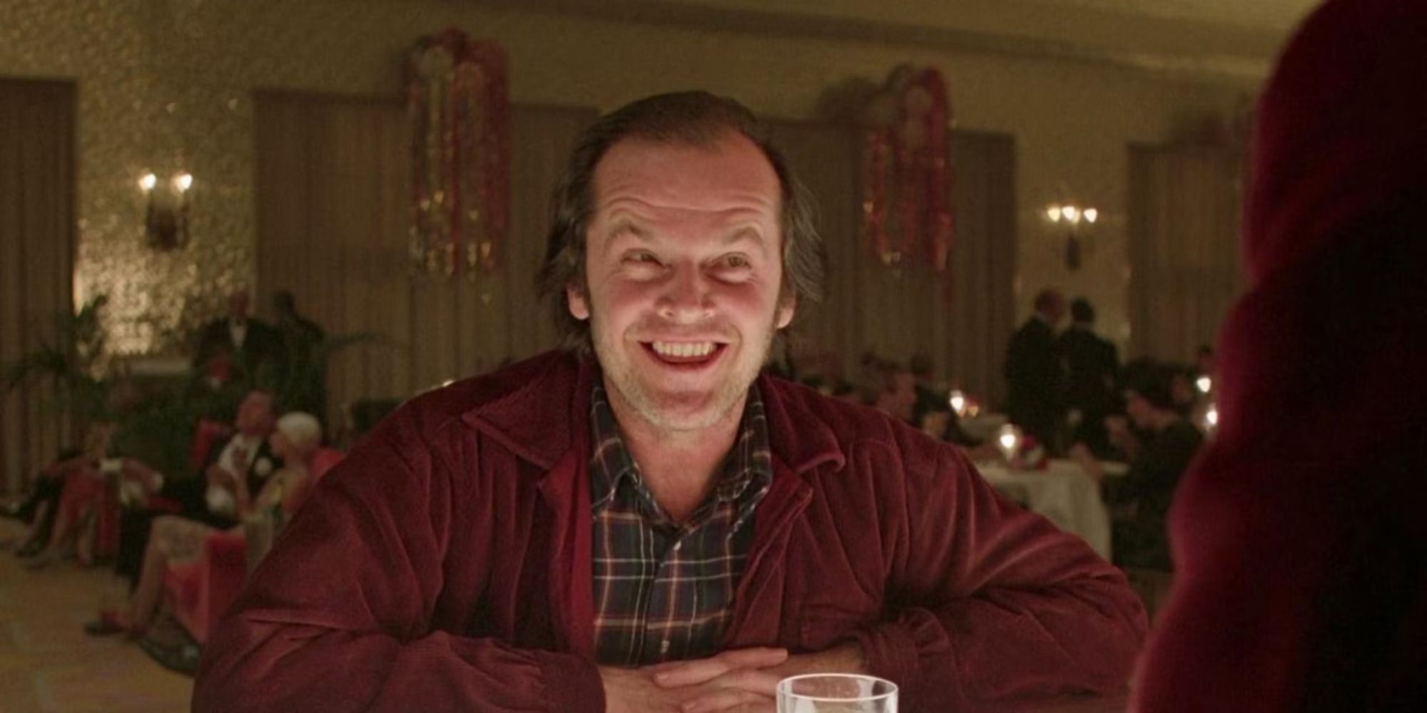 Jack Torrance (Jack Nicholson) smiling at the bar in 'The Shining'