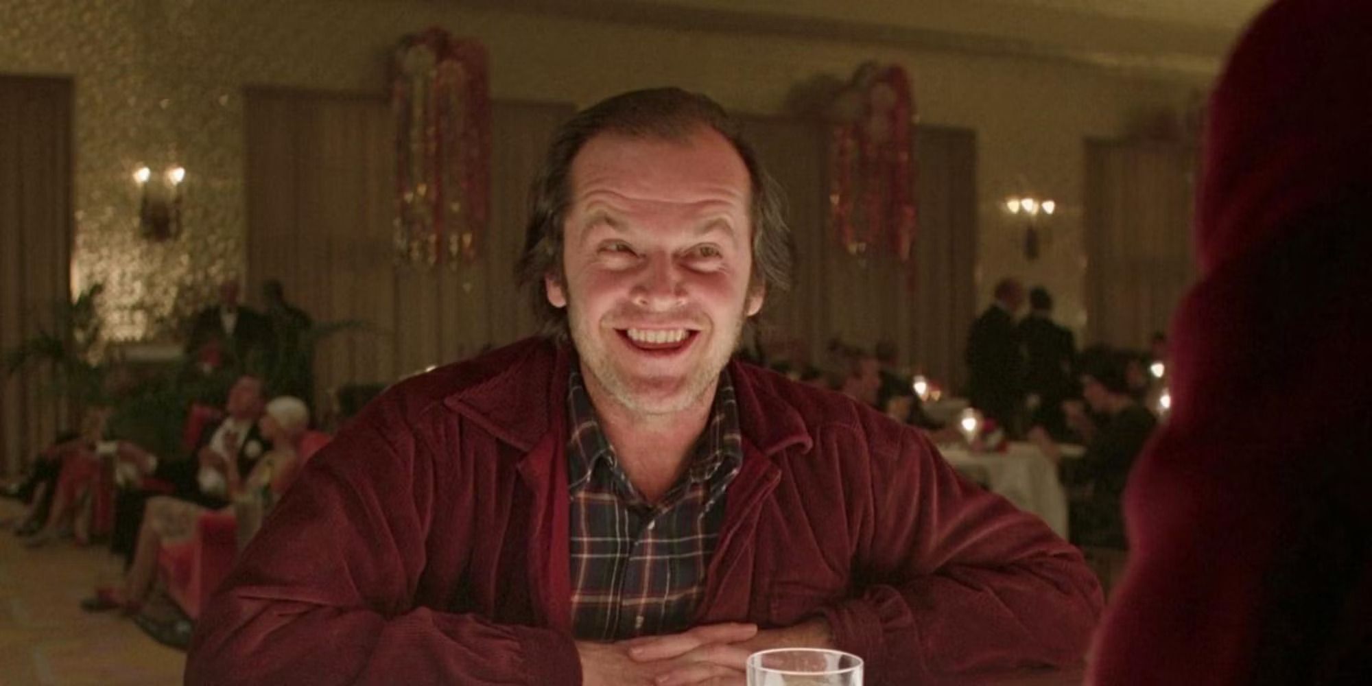 Jack Nicholson as Jack Torrance smiling at the bar in The Shining