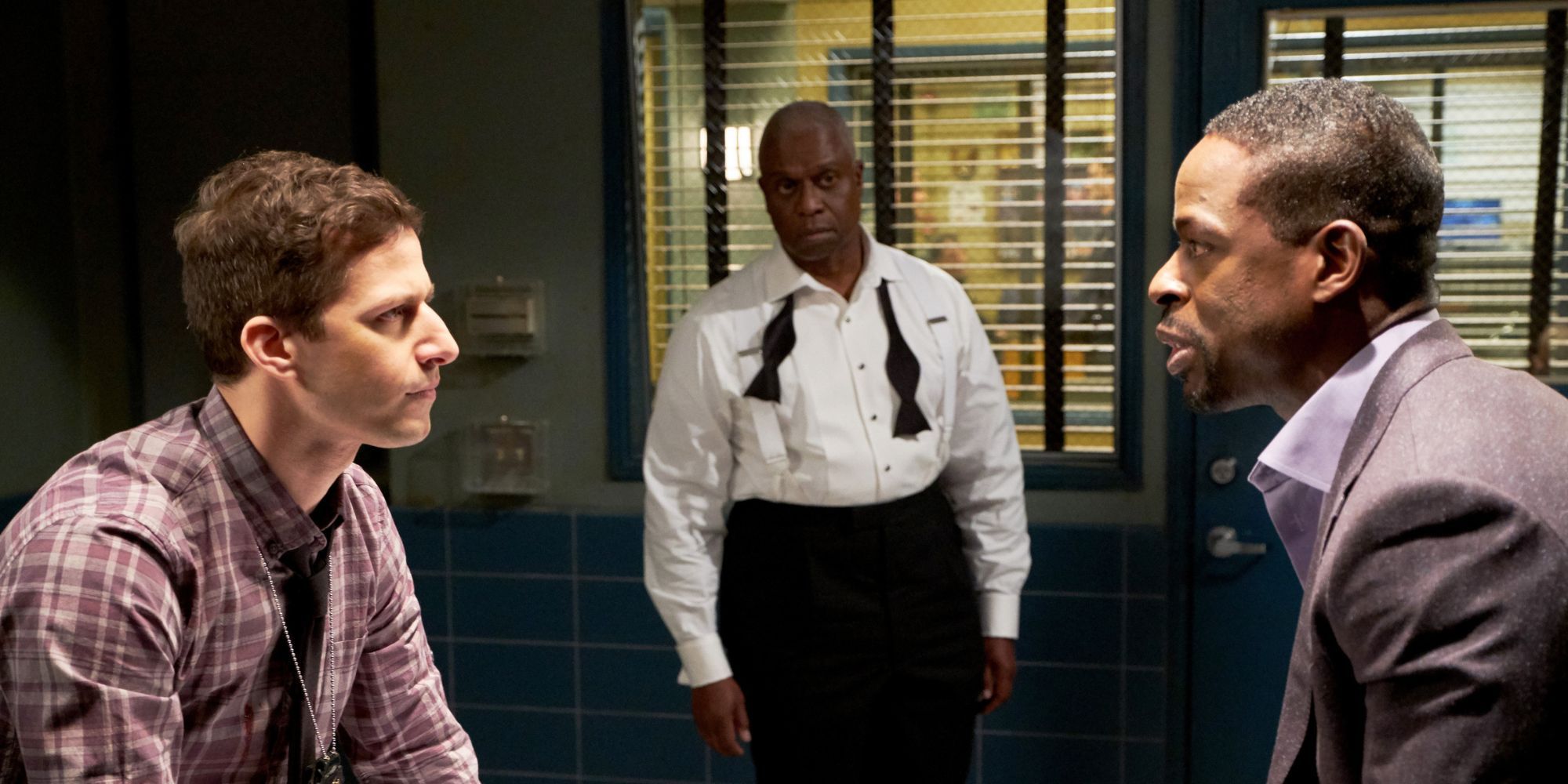 Jake and Holt from Brooklyn Nine Nine interviewing a criminal