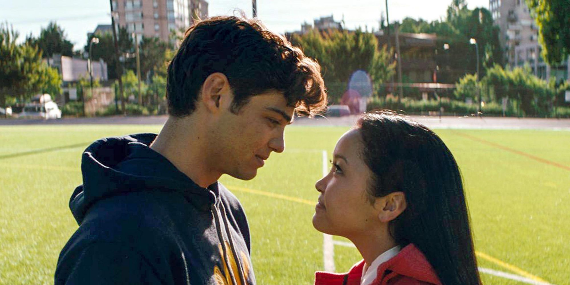 Peter and Lara Jean from To All The Boys I’ve Loved Before looking at each other