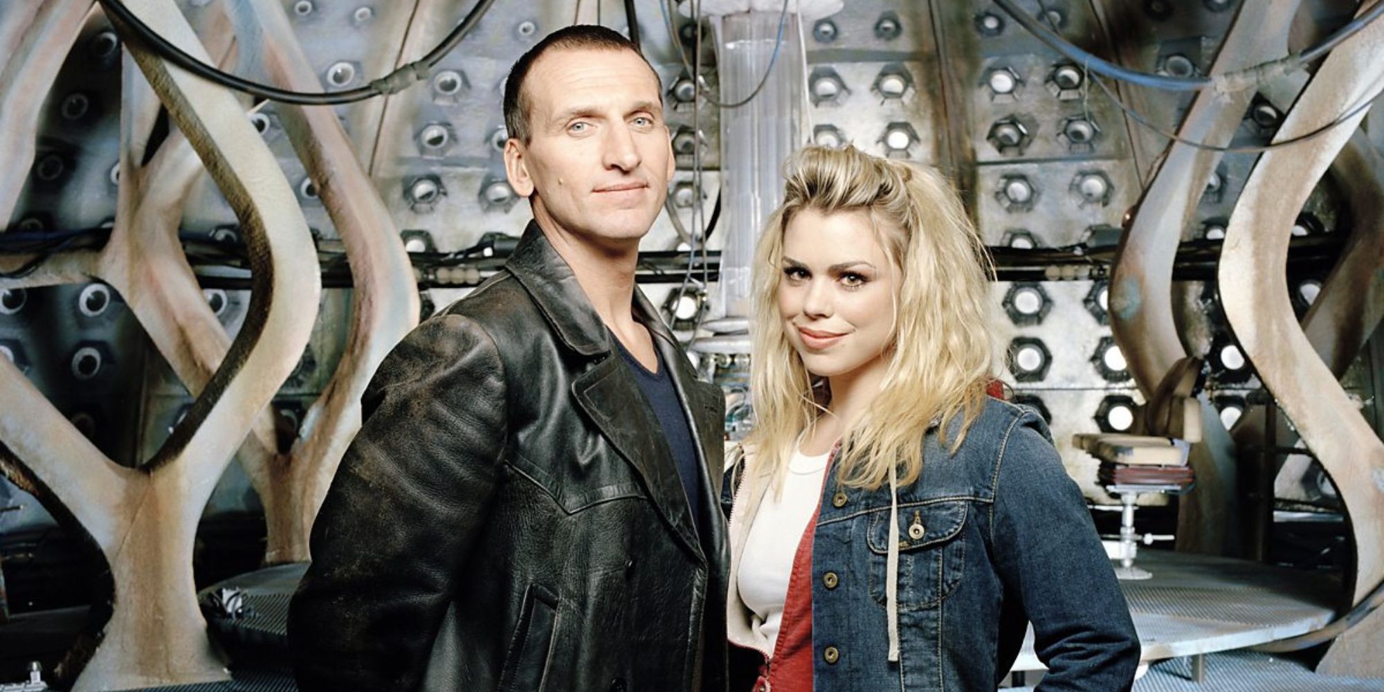 Rose Tyler and the Ninth Doctor stand smiling in the TARDIS on Doctor Who