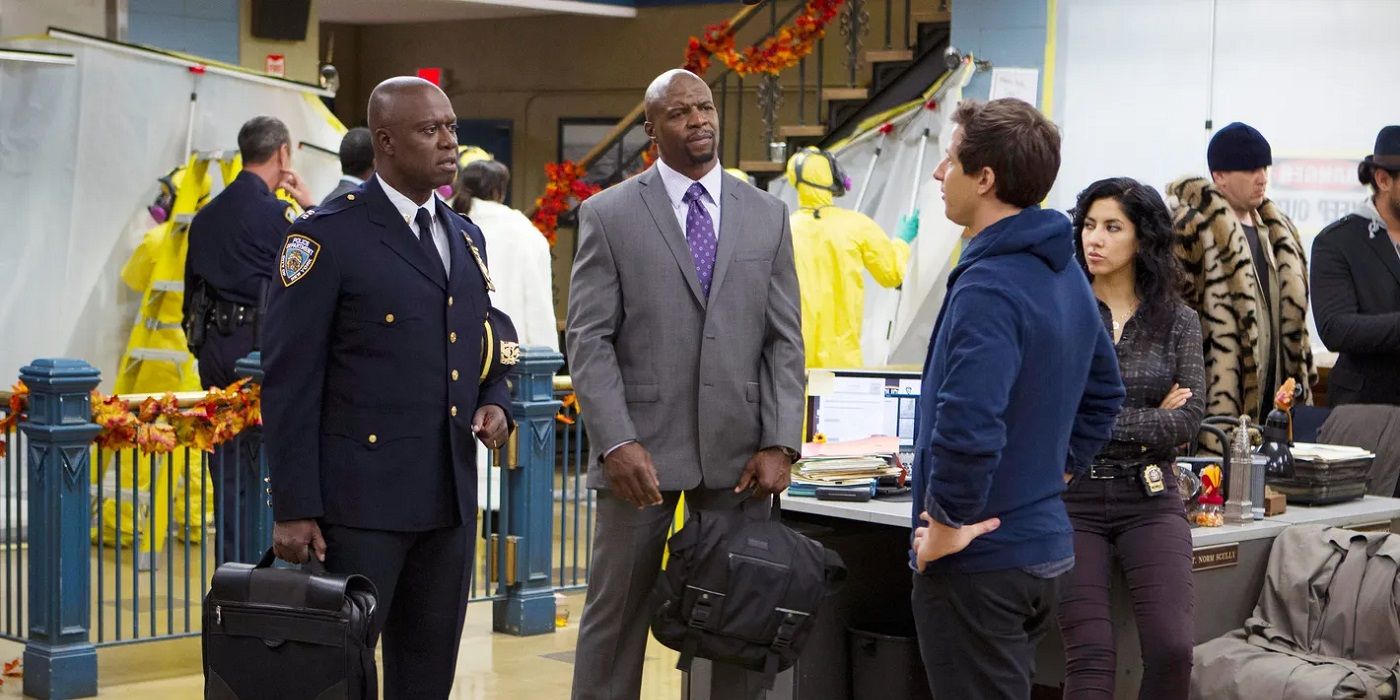 The cast look annoyed as people in hazmat outfits quarantine an area in Brooklyn Nine-Nine.