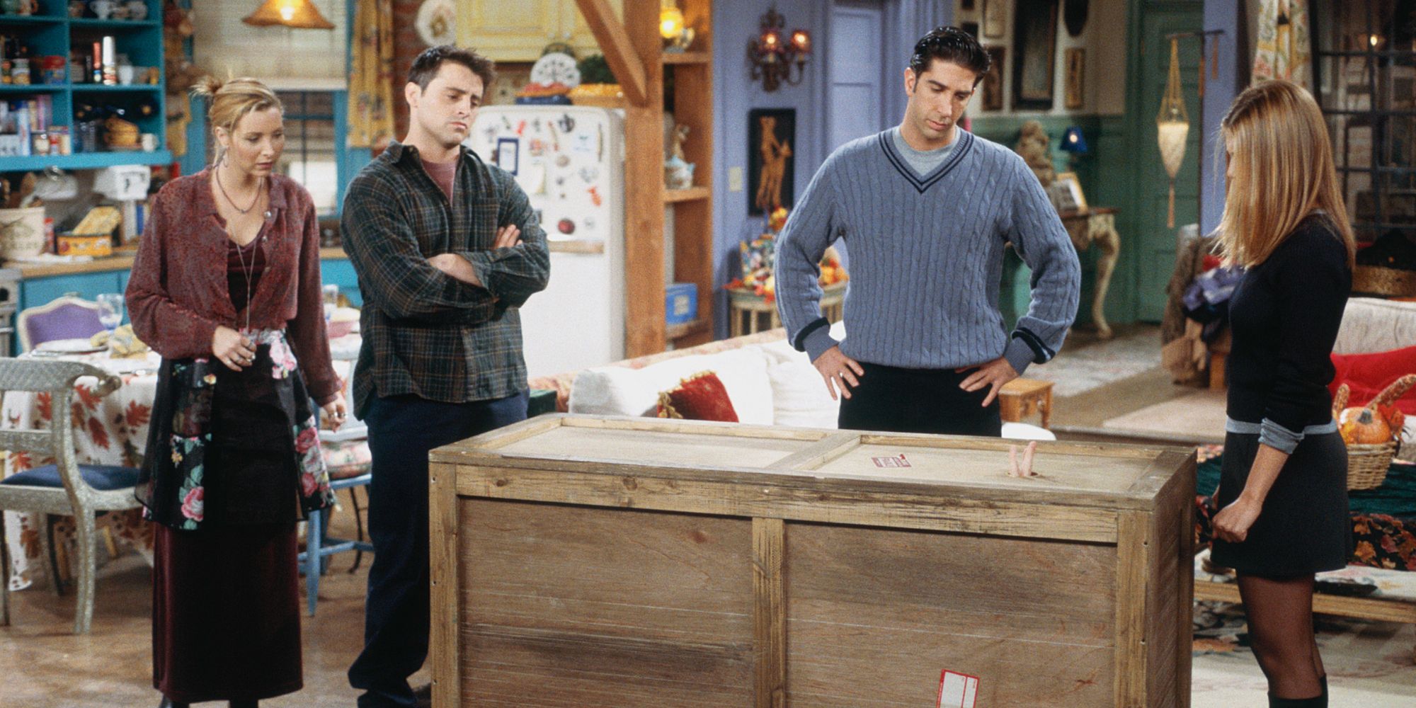 Phoebe, Joey, Ross and Rachel looking at the box with Chandler in it