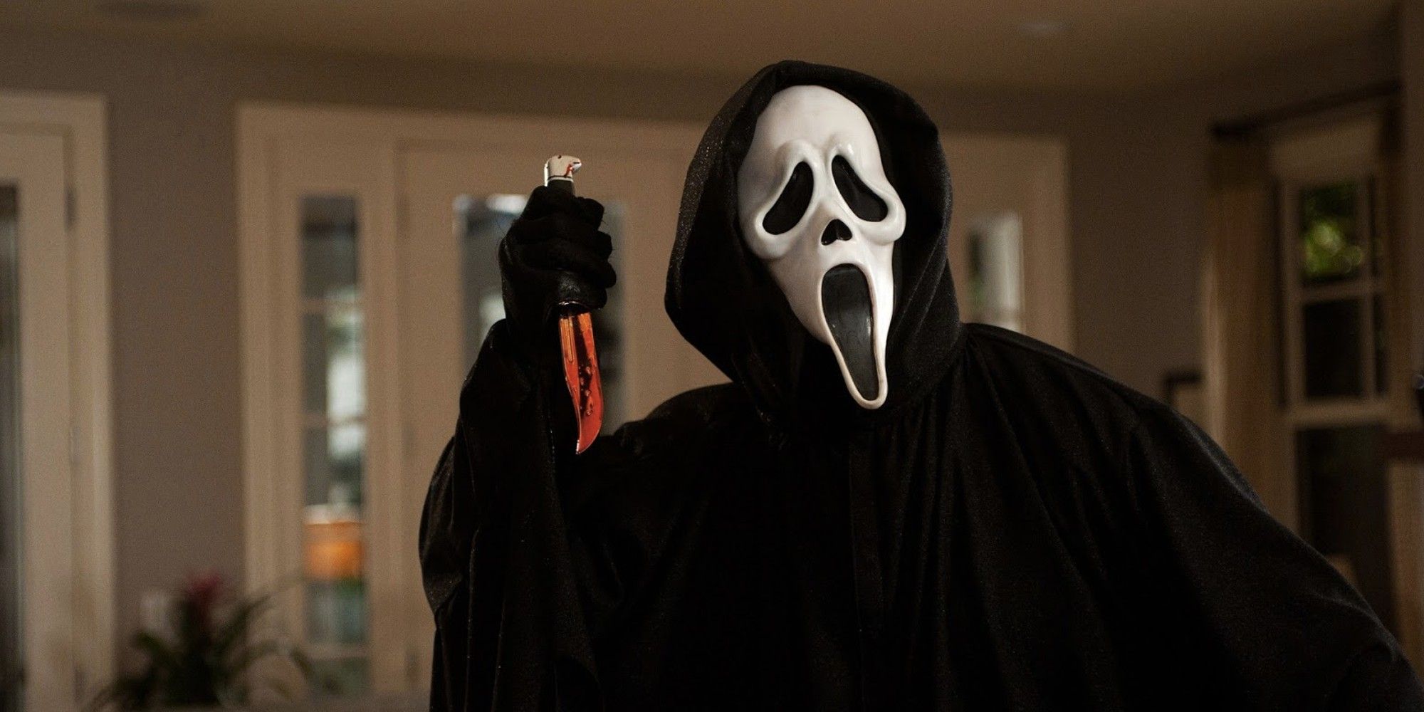 A ghost face holding a knife in Scream