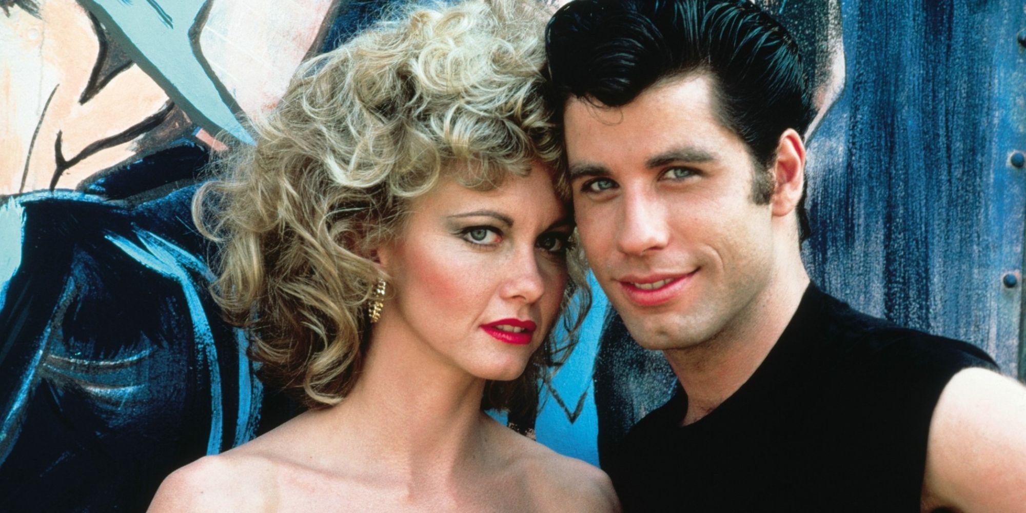 John Travolta as Danny and Olivia Newton-John as Sandy in Grease