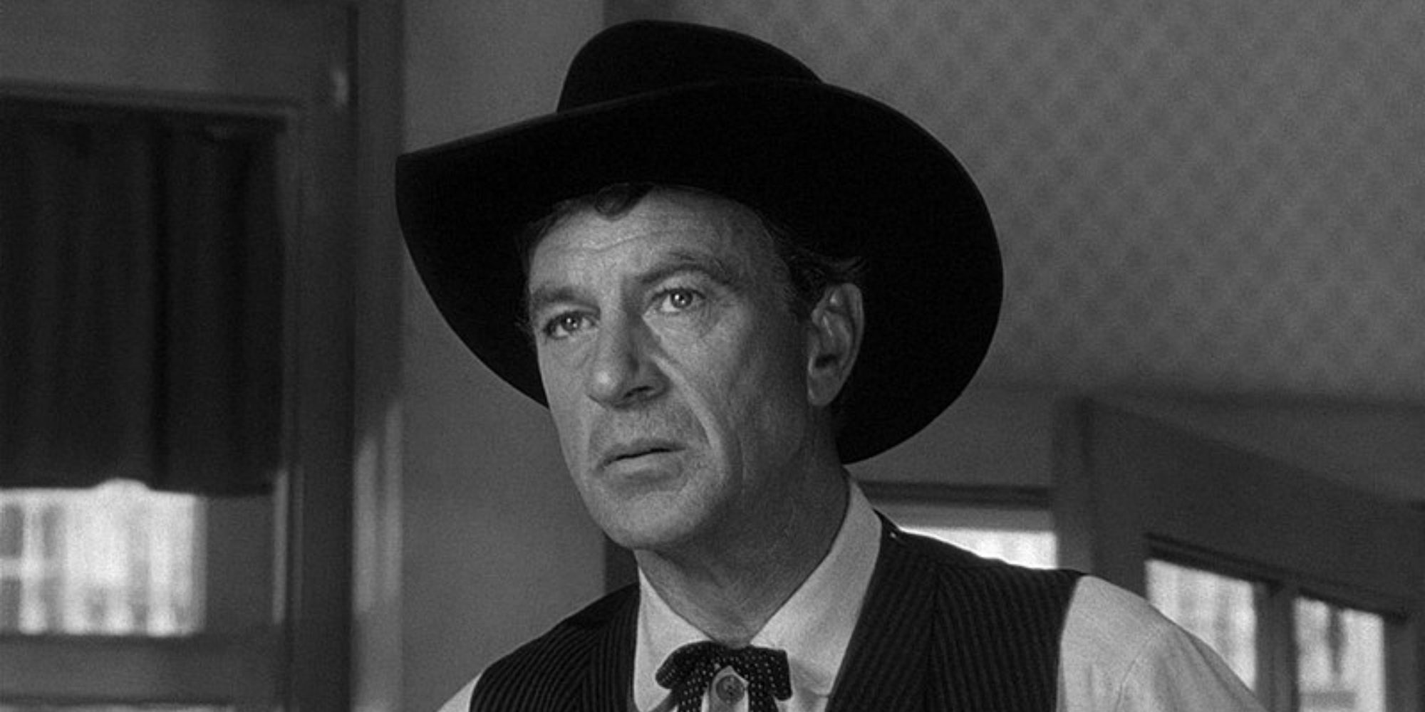 Will Kane in a saloon looking intently off-camera in High Noon