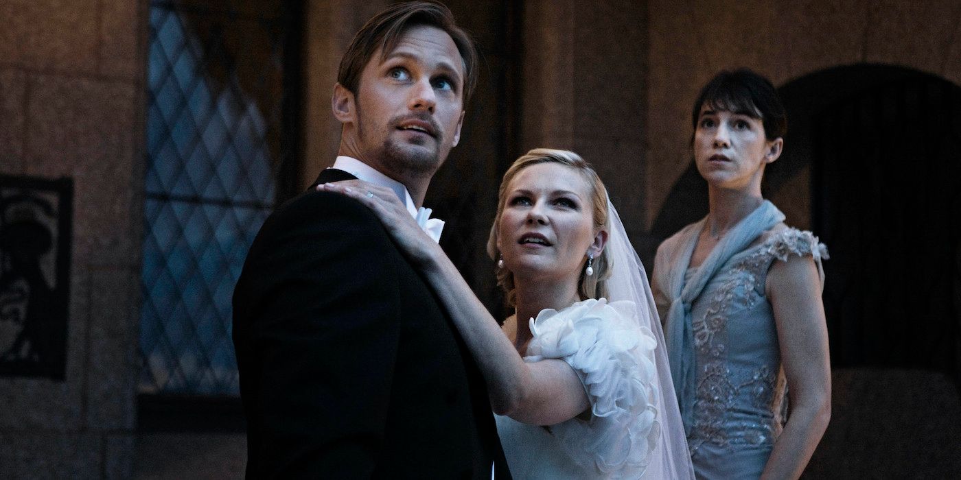 Alexander Skarsgård, Kirsten Dunst, and Charlotte Gainsbourg as Michael, Justine, and Claire looking up at night in Melancholia.