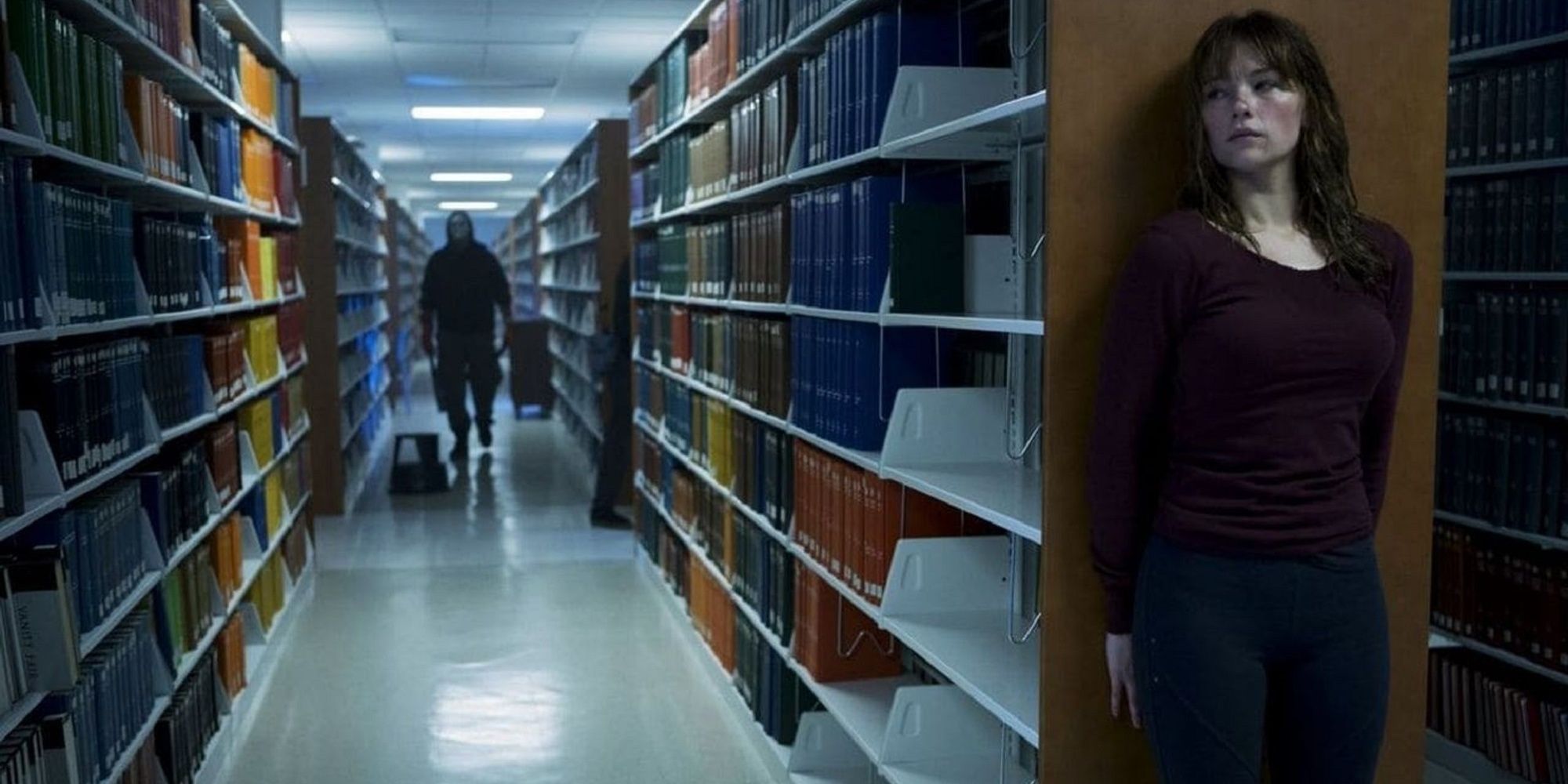 Justin is being hunted by a cultist killer in 'Christy's' library.
