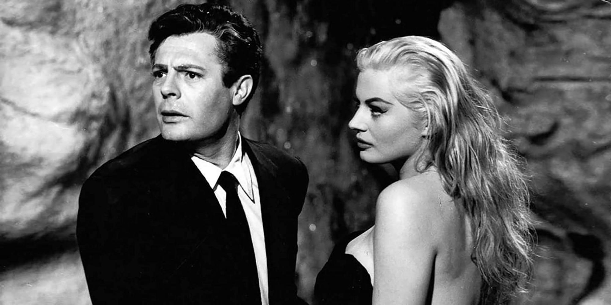 Sylvia looking at Marcello, whose looking to the distance with a puzzled expression, in La Dolce Vita