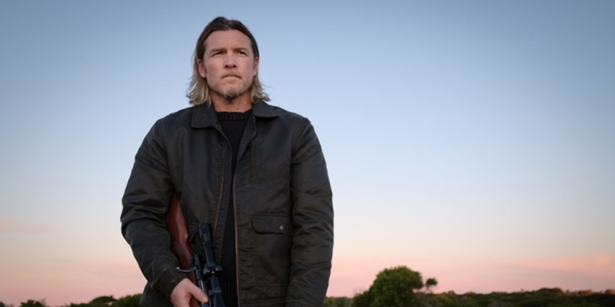 A man holding a gun standing in nowhere