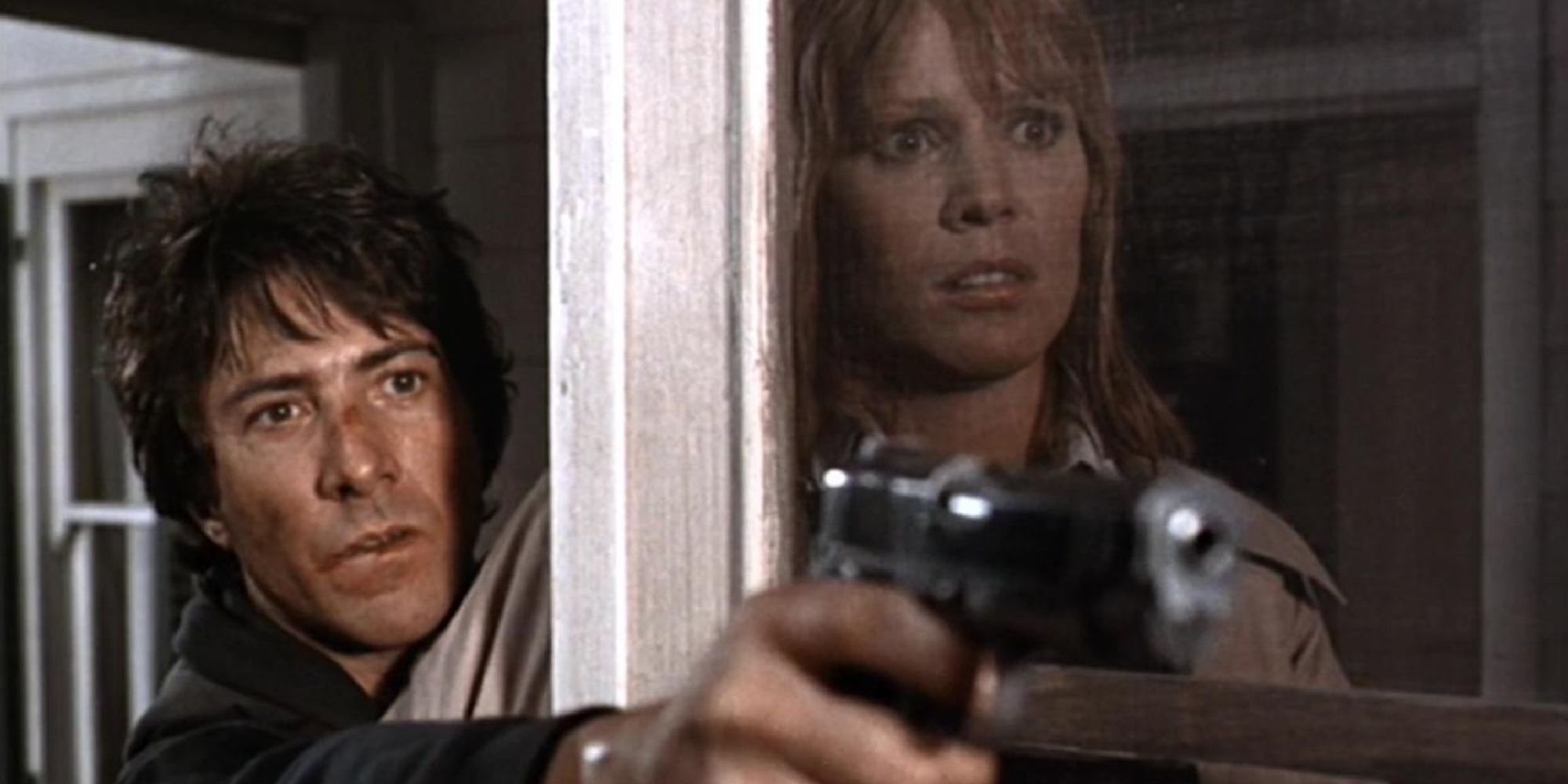 Thomas Levy (Dustin Hoffman) protecting Elsa Opel (Martha Keller) with a gun and a screen door in Marathon Man