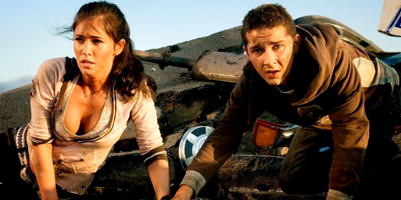 Mikaela Barnes and Sam Witwicky looking to the distance with confused expressions in Transformers