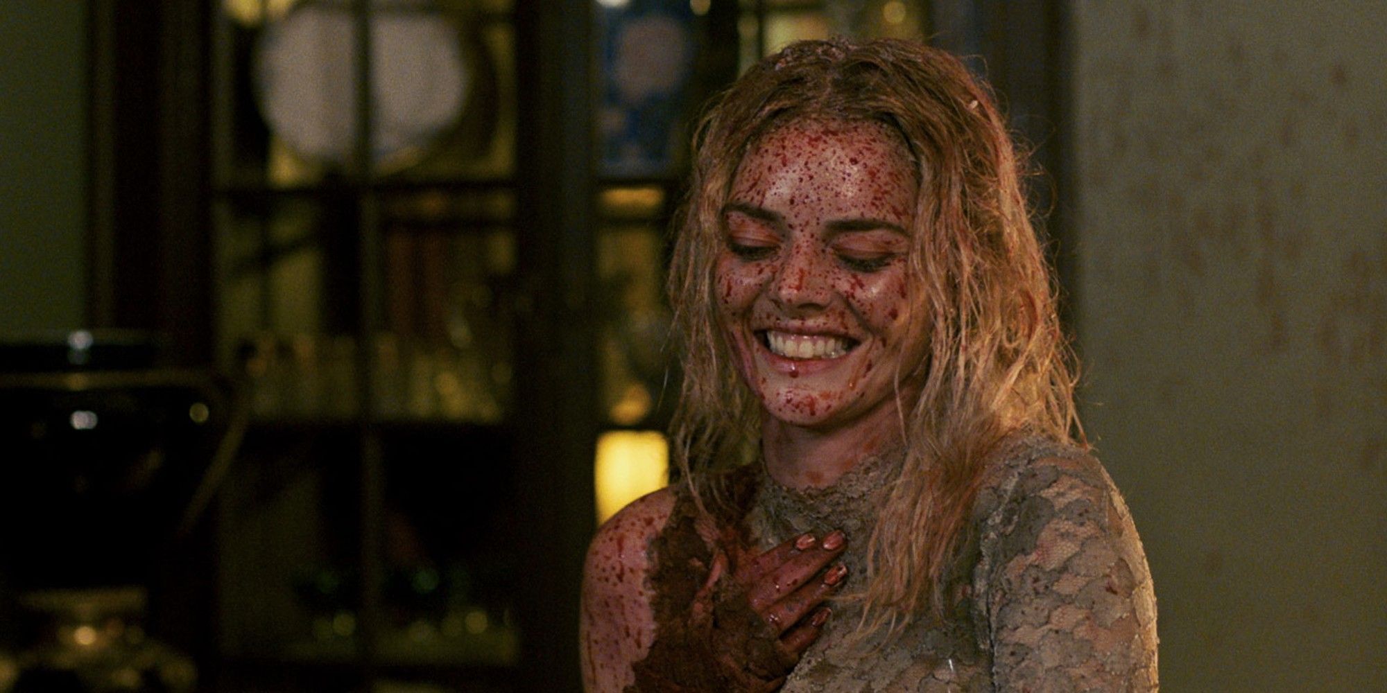 Samara Weavering's Grace smiling with blood all over her in 'Ready or Not'